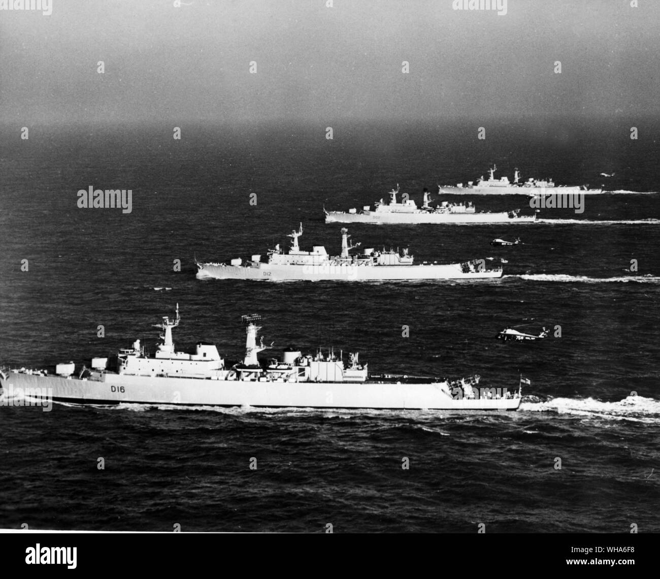 The Four Sisters, the four County Class Guided Missile Destroyers now in service with the Royal Navy in line abreast during exercises in the channel. Front to rear, HMS London, HMS Kent, KMS Devonshire and HMS Hampshire with their Wessex helicopters in flight. February 1964 Stock Photo