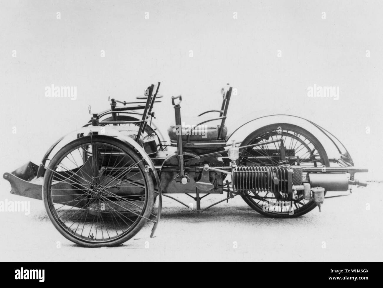 Bollee Tricar. 1896. A tandem motor tricycle by Messrs L and A Bollee. It has a single rear wheel and is steered by the two front wheels. A single cylinder horizontal air cooled engine drives the rear wheel through a three speed gear and a flat belt. Stock Photo