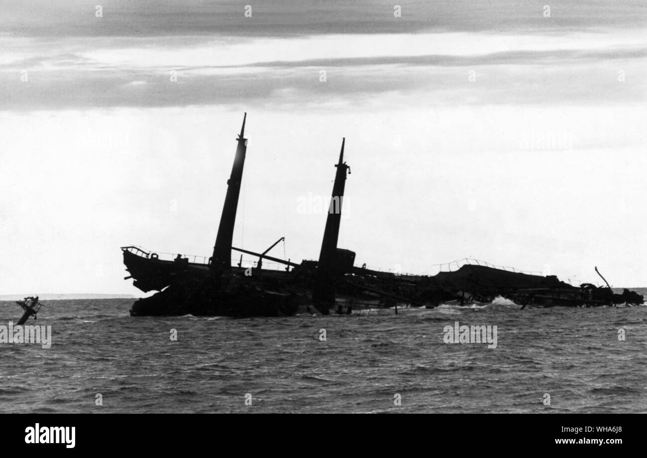The Death of the Torrey Canyon. Dawn on the 14th day and silhouetted against the cornish sky is the doomed tanker the Torrey Canyon. It took 161 bombs. 16 rockets. and 3,200 gallons of Napalm to break her up. 1st April 1967 Stock Photo