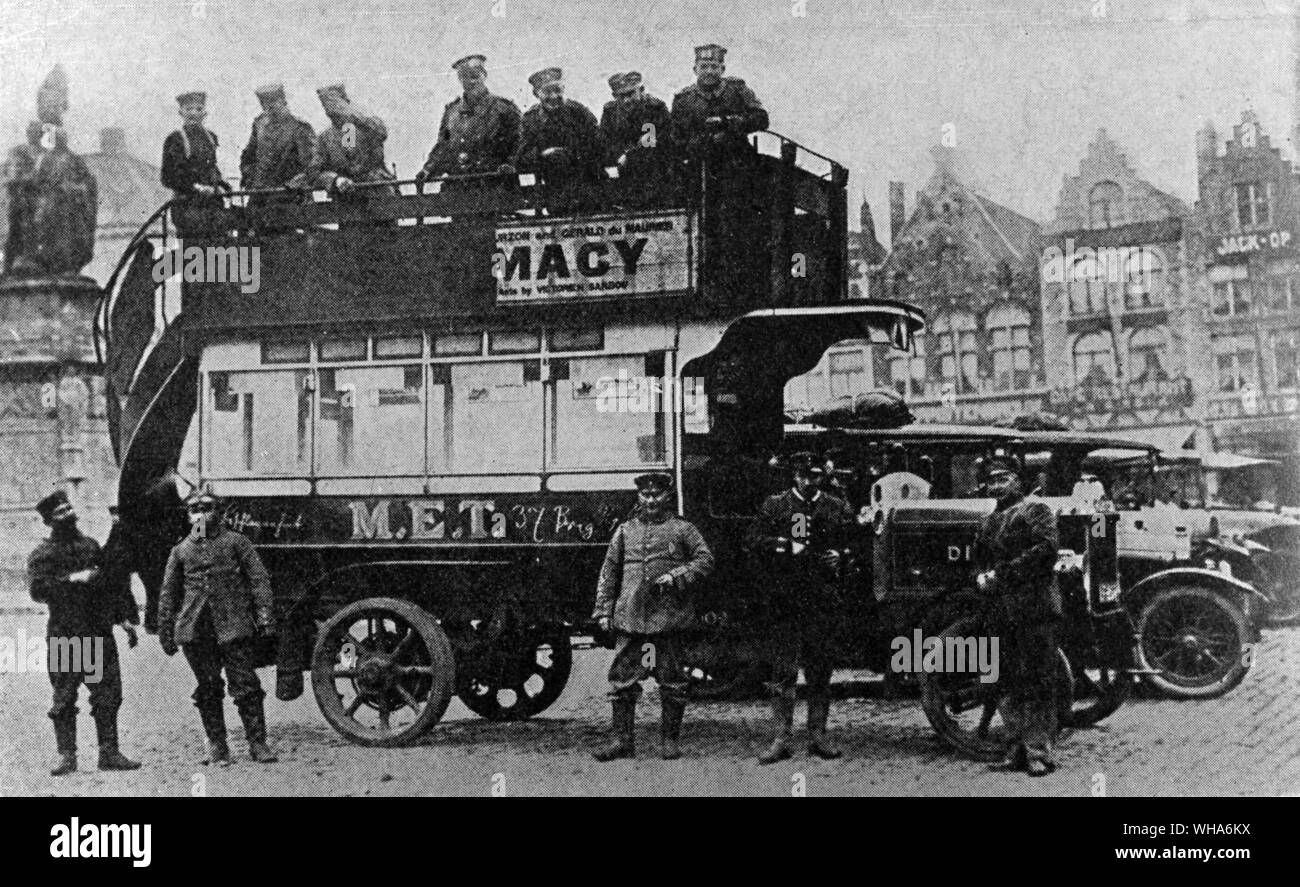German soldier poses in front of their booty in Antwerp November 1914. A London Motor Omnibus taken in Antwerp by the enemy. Motor omnibuses have done excellent service in the transport of troops and supplies Stock Photo