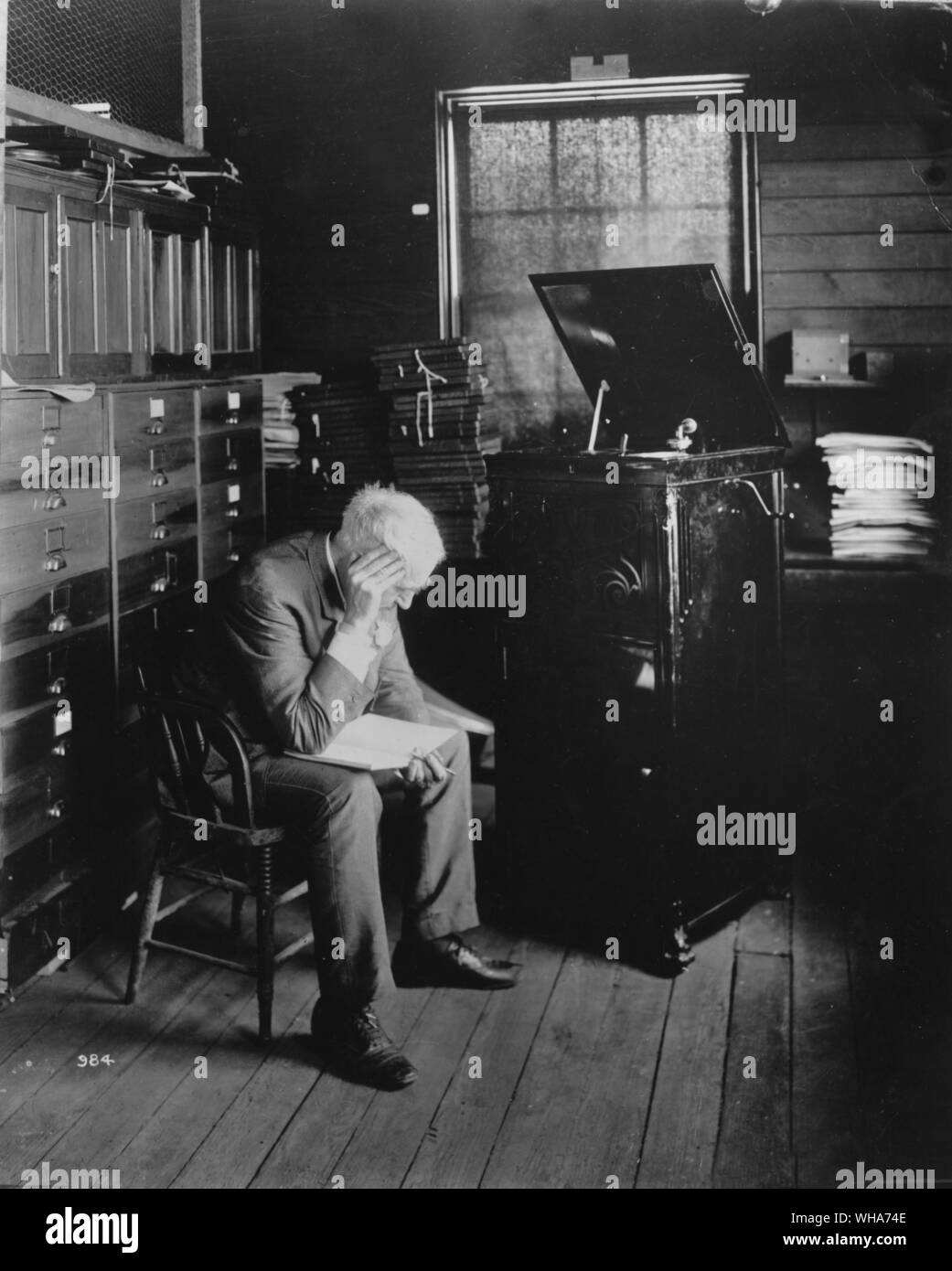 Thomas Edison listening to new disc phono. . Edison, Thomas Alva (the Wizard of Menlo Park) US inventor; opened research laboratory in Menlo Park, New Jersey 1876 (moved to West Orange, New Jersey 1887); invented phonograph (1st demonstrated 1877); invented incandescent electric light 1879; invented kinetograph camera and kinetoscope motion-picture viewer (patented 1891)  1847-1931 . . . . . . Stock Photo