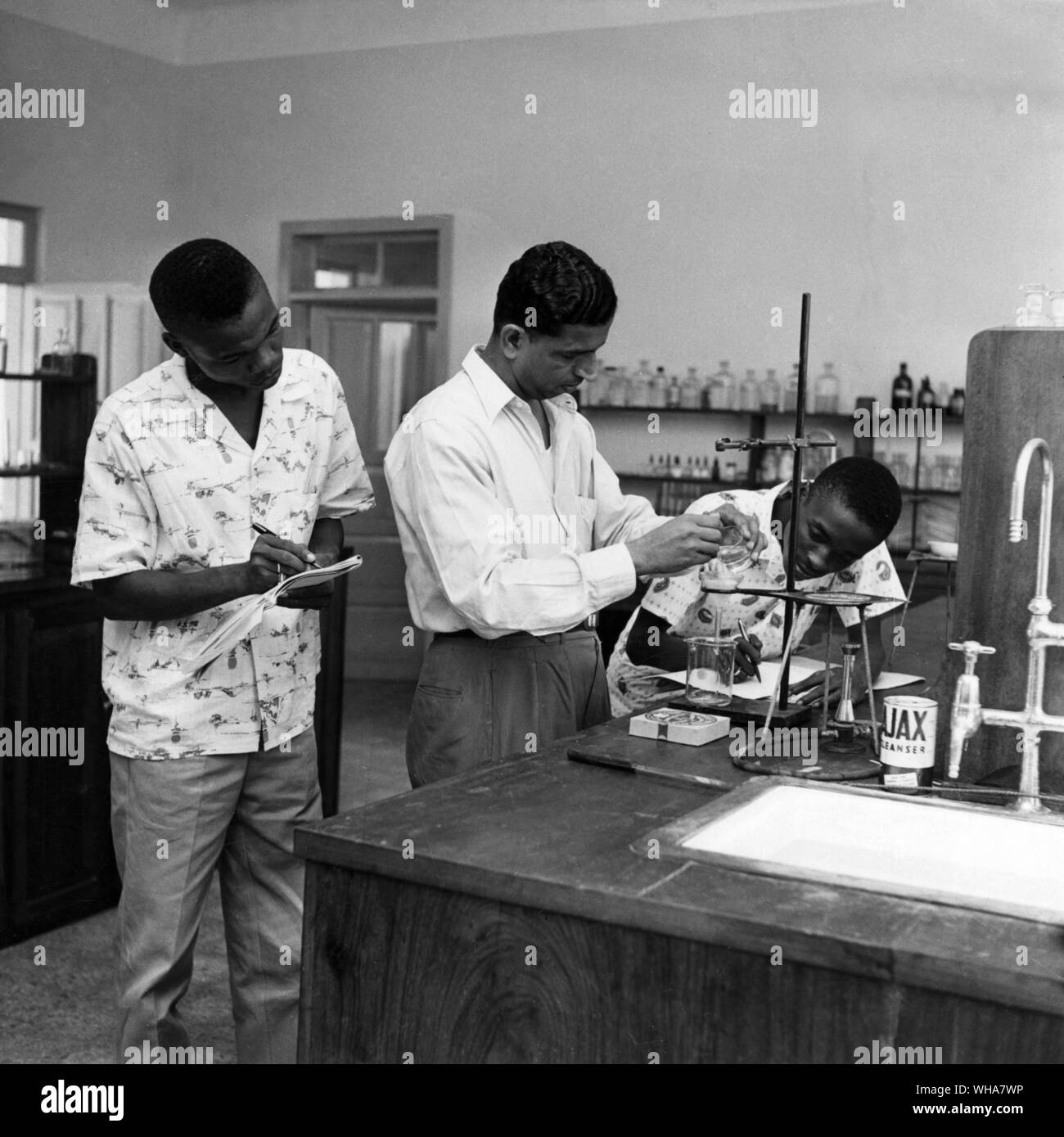 Although the Arts are by no means neglected in Liberia, the University's emphasis is on science and technology. Here we see students helping to build a Nation in a beaker Stock Photo