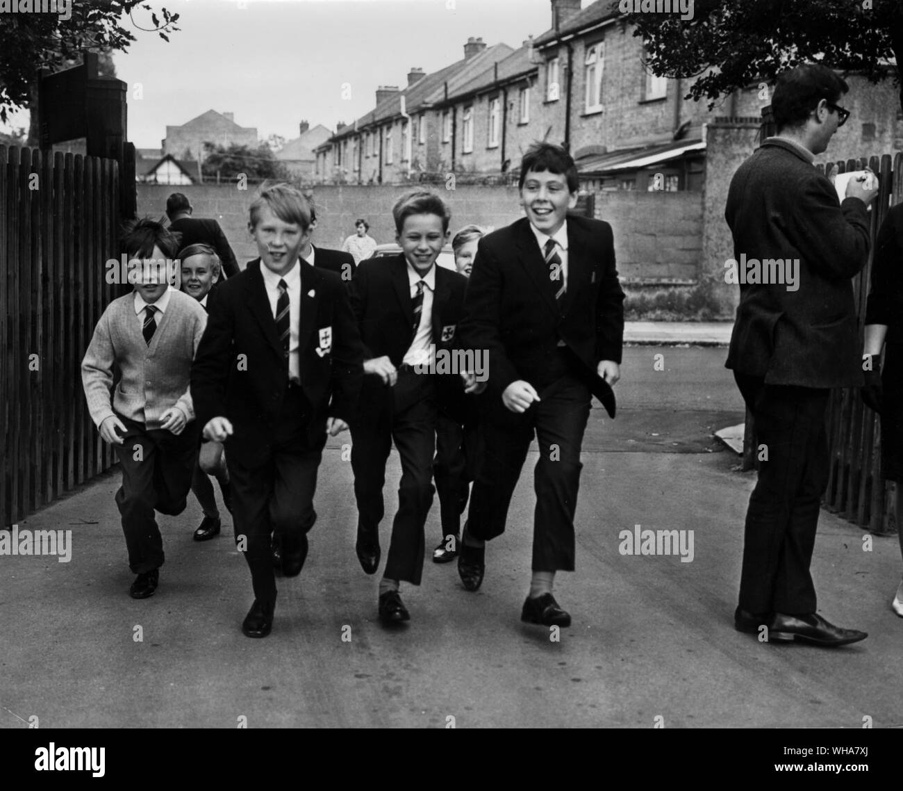 Enfield Grammar School. Lower School. three 11 yr old schoolboys eager to get back to school. All of the 177 boys who were unable to resume school because of the High Court Injunction over Enfield Grammar School were back in school today. Enfield Education Committee last night agreed by a Labour majority vote to ask Mr Patrick Gordon Walker, Secretary for Education and Science to approve a declaration that the grammar school shall become the upper school of a comprehensive unit for boys aged 14 to 18 linked to the Chace School as the Lower school. 20th September 1967 Stock Photo