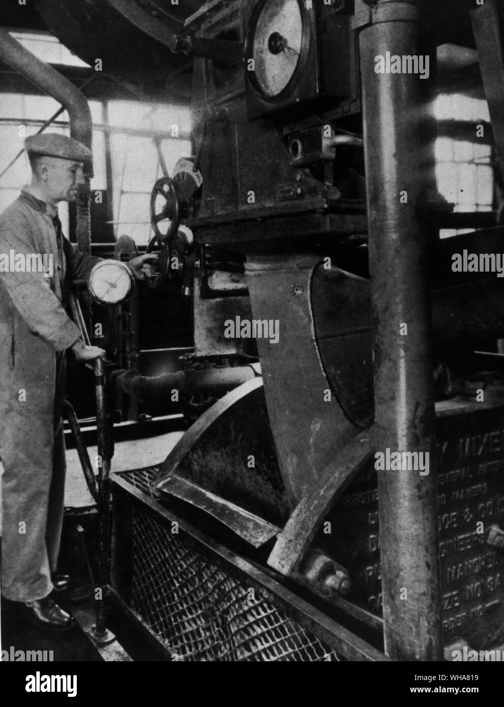 The first Banbury mixer was adapted from rubber processing equipment. The moulding material ingredients, powdered resins, wood flour, plasticisers and dyes etc., are pre-mixed and then fed into the Banbury where they are thoroughly churned and kneaded in a steam jacketed chamber. Bakelite Xylonite Ltd Stock Photo