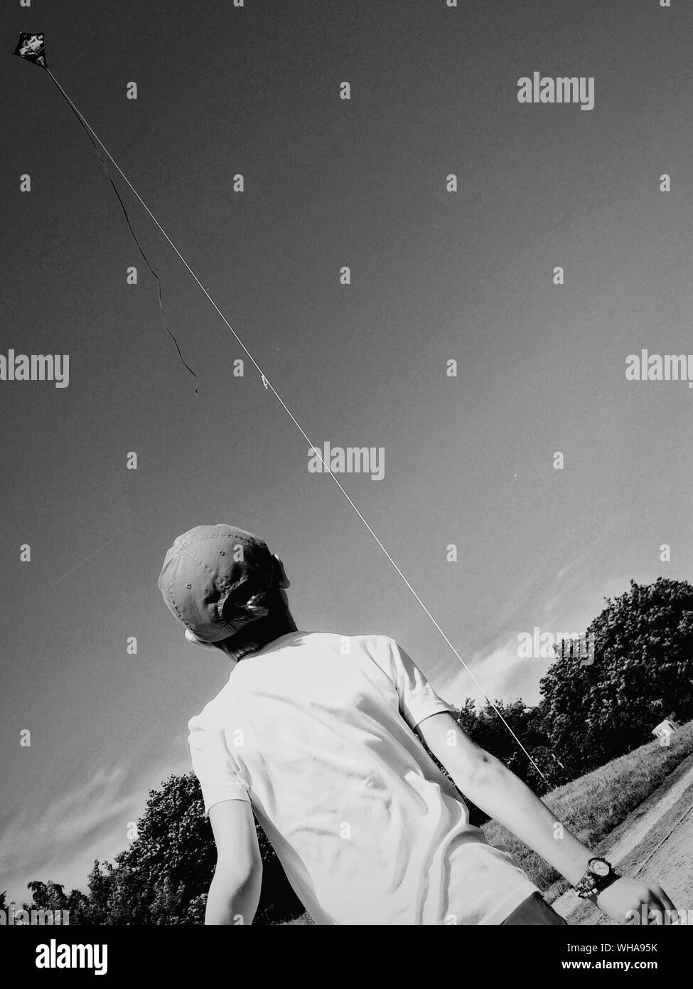 Boy flying kite outdoors hires stock photography and images Alamy