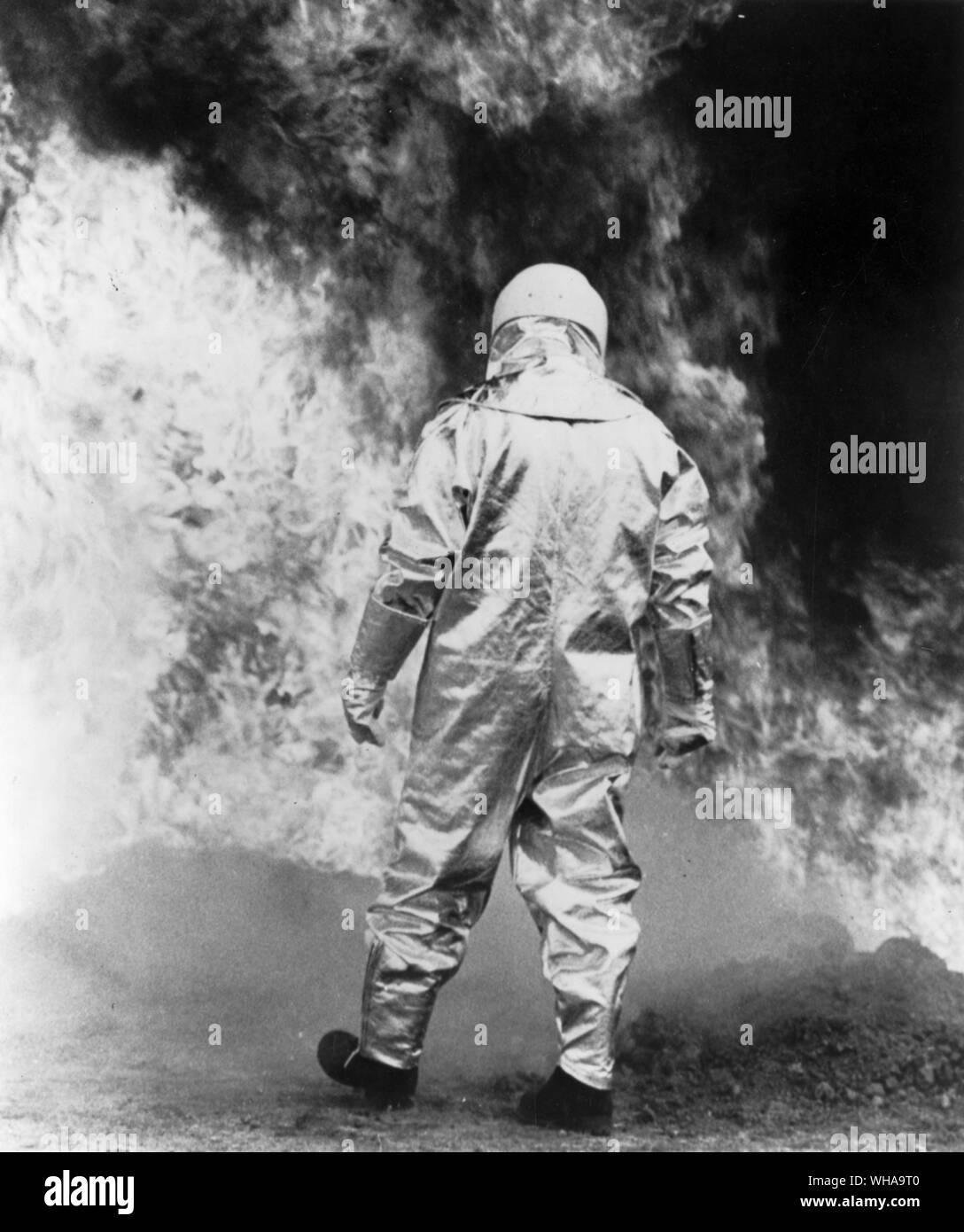 Asbestos. Man made fibres. approaching the fire in an asbestos suit Stock Photo
