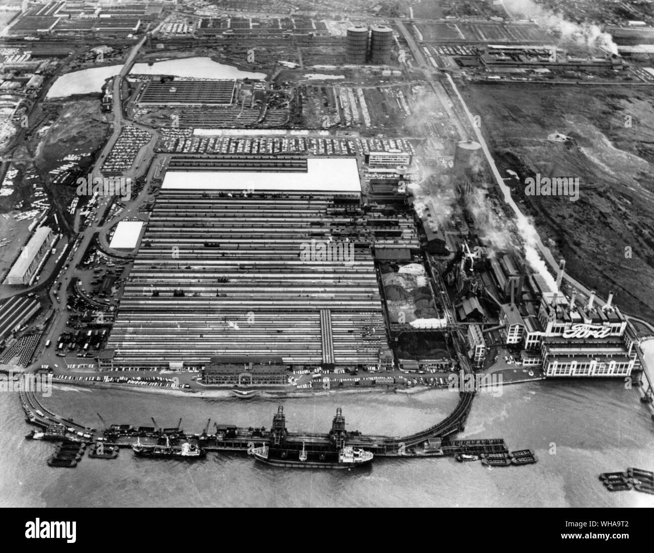 An above Thames view of the Ford engine plant at Dagenham where an £18 million expansion plan is announced today. Accommodating 2 and a quarter million sq ft of floor space under one roof, it is to incorporate 300.000 sq ft of new buildings, shown as an L shape white section at the top of the picture, and the white square at left which represents a computer controlled warehouse for the storage of components and assemblies. 19th June 1969. Stock Photo