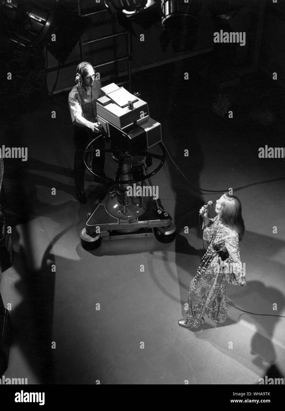 The Marconi Mark VIII automatic colour camera was demonstrated for the first time at the 1970 International Broadcasting convention at Grosvenor House. A highly specialized miniature computer built into the camera channel controls alignment and colour balance at the touch of a button. The photograph shows the camera in studio use and clearly demonstrates its small size and compact design. Stock Photo