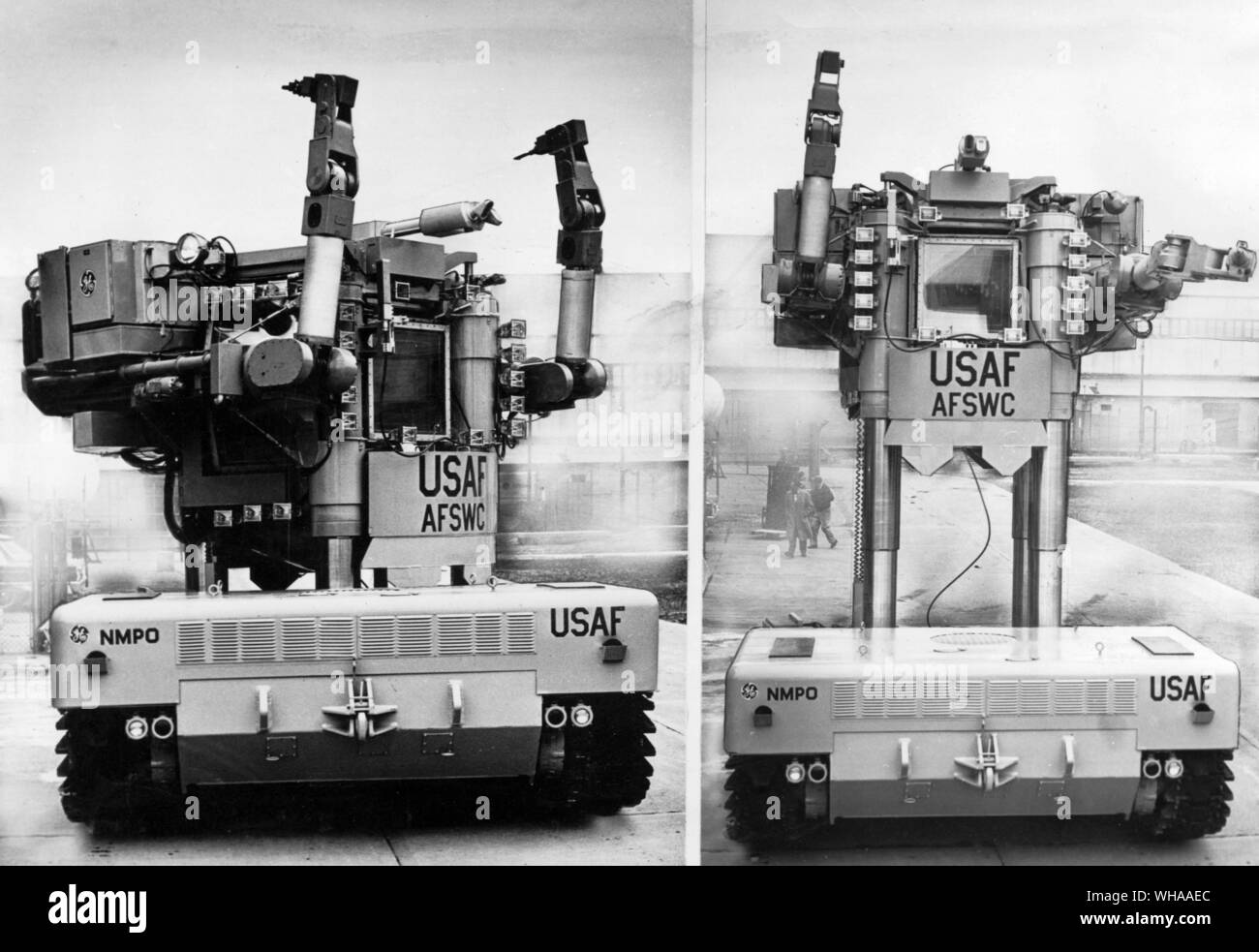 85 ton robot will handle radioactive materials. This 85 ton robot named Beetle is being tested for work in 'hot' nuclear areas by the US Atomic Energy Commission and the Air Force in the State of Nevada. The operator, protected by thick lead and glass shields turns his cab left and raises it 25 feet above the ground. The mechanical arms can carry parts and perform intricate operations on nuclear power and propulsion systems Stock Photo