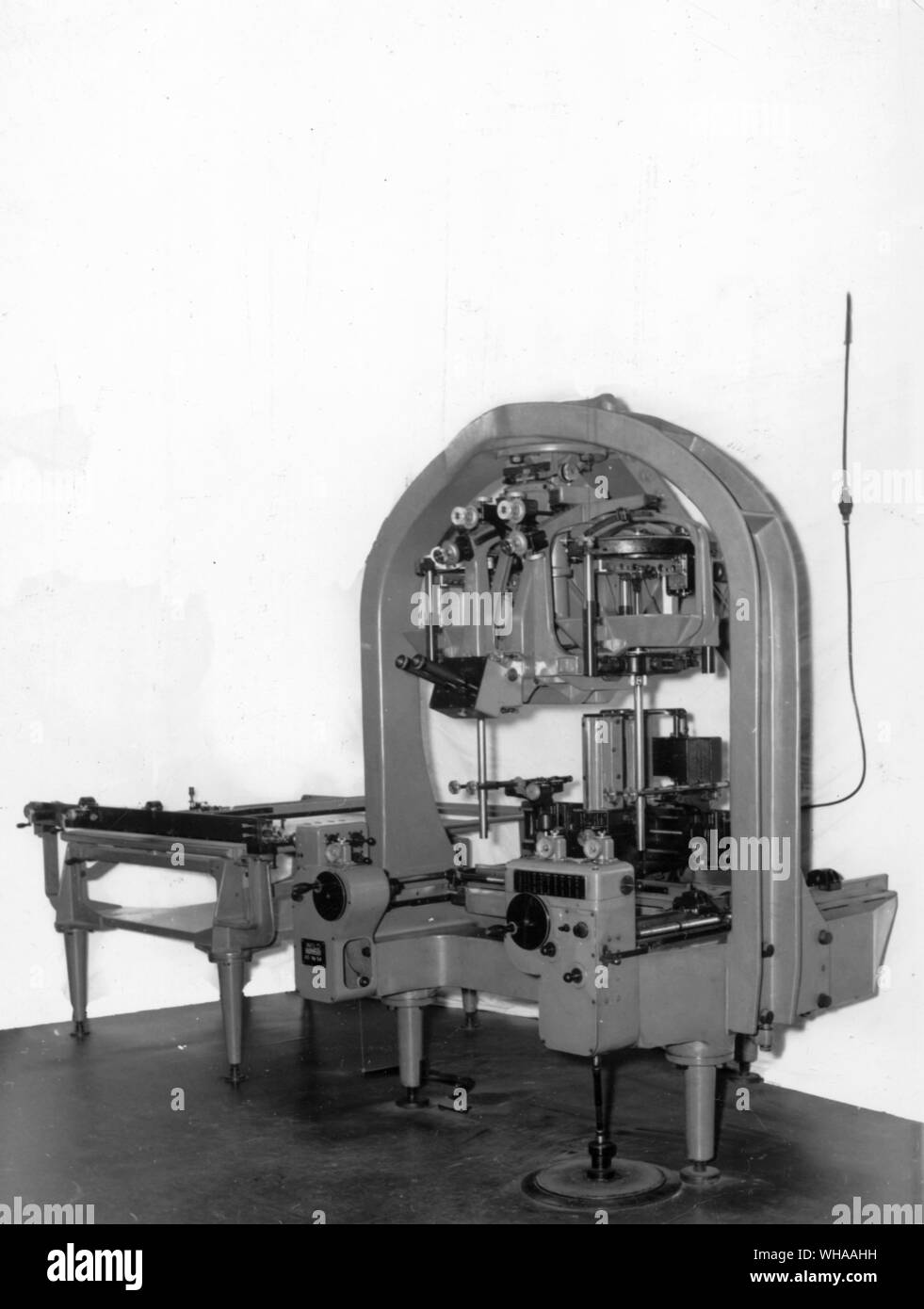 An optical mechanical type of plotting machine. The goniometers representing the two camera positions may be seen with the space rods representing the rays to detail points projecting below them. In the photograph the space rods are both vertical but during actual plotting they would be convergent. The plotting table is at the left. Stock Photo