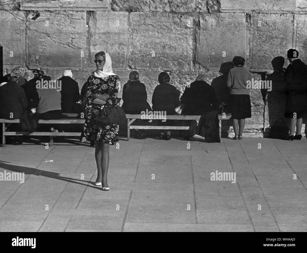 Woman at the Wailing Wall The western retaining wall of the ancient Temple in Jerusalem, which is as close to the site of the original Sanctuary as Jews can go today. Commonly known as the Wailing Wall. . Stock Photo