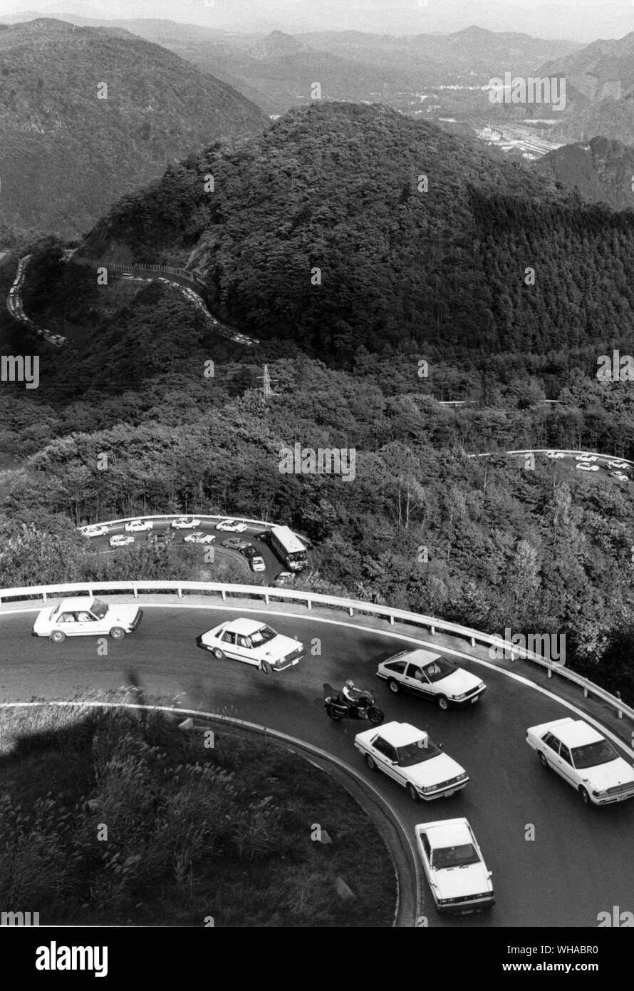 This road zig-zagging through Nikko National Park and famous for 'autumn colour viewing' has the same number of curves as there are in the Japanese alphabet. Unwary tourists may find themselves suddenly surrounded by a macaque troop on the rampage for food Stock Photo