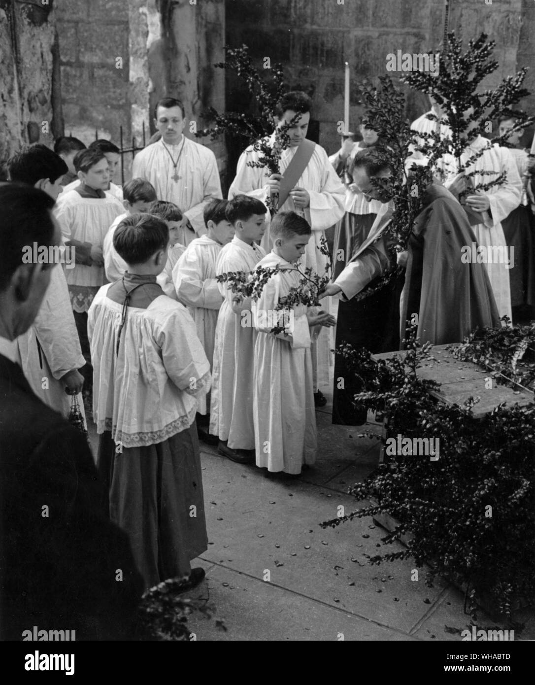 On Palm Sunday the whole congregation goes in Procession carrying palms in memory of Christ's entry into Jerusalem. Branches of local shrubs are often carried instead of the palm leaves Stock Photo