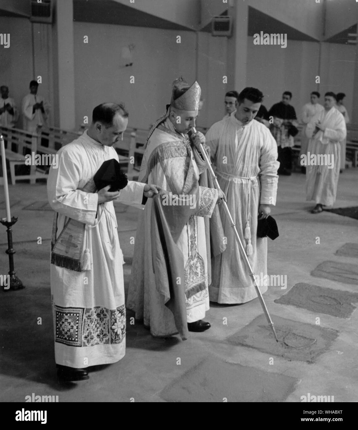Dedication of a church. As part of the ceremony the bishop traces the letters of the Greek and Latin alphabet in sand on the floor. This is an ancient form of talking, possession. Stock Photo