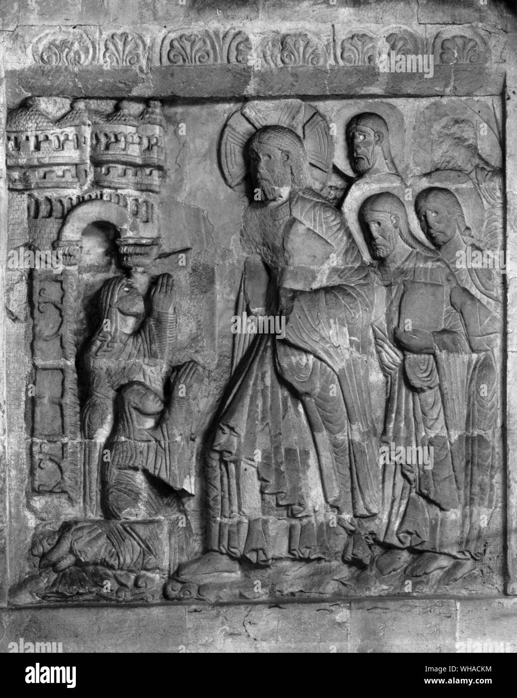 Mary and Martha at the Gate of Bethany kneeling before Christ and the Apostles c 1140 Stock Photo
