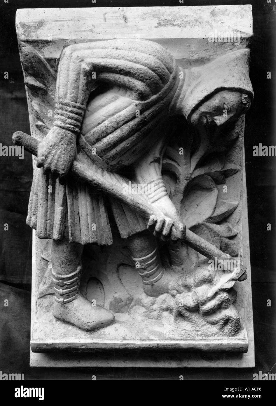 Cultivating the vine. Stone relief. Freiburg Minster Stock Photo