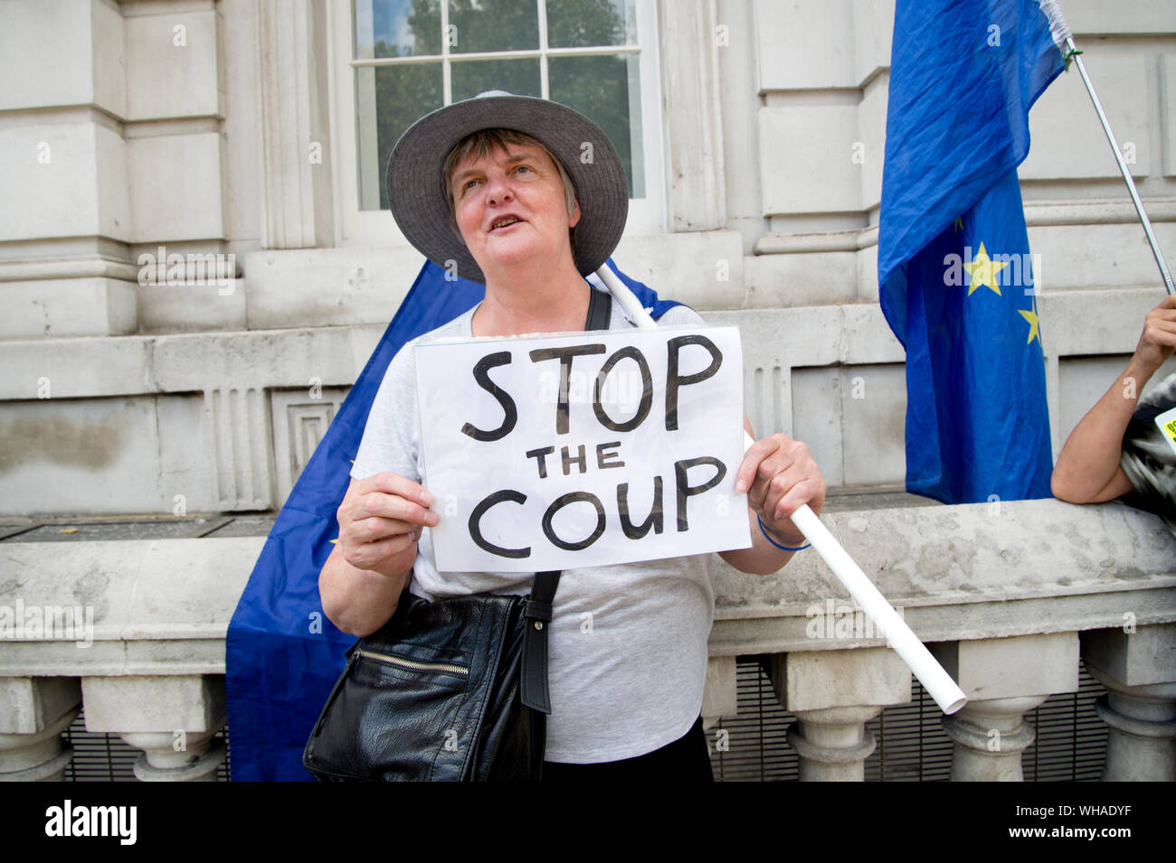 Parliament, Whitehall 2.9.2019. Remain protesters outside the Cabinet Office, one holds a sign saying 'Stop the Coup'. Stock Photo