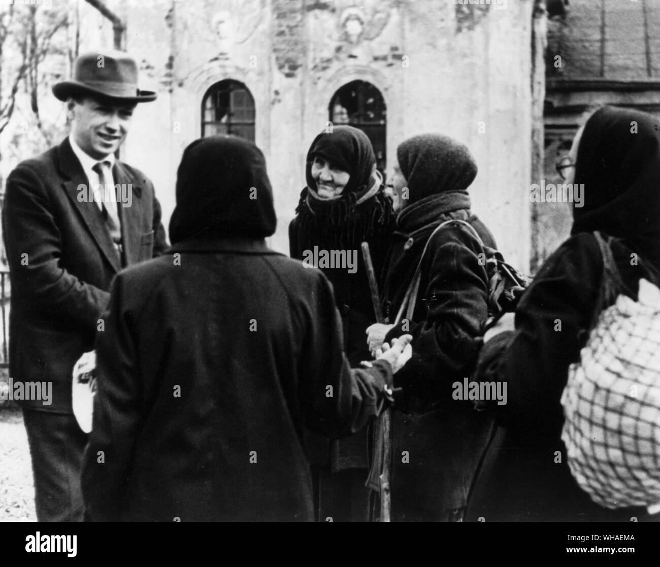 Control is a constant preoccupation of the Soviet authorities. Here, a local Party secretary is trying to dissuade a group of women who want to hold a religious service in a collapsing old monastery Stock Photo