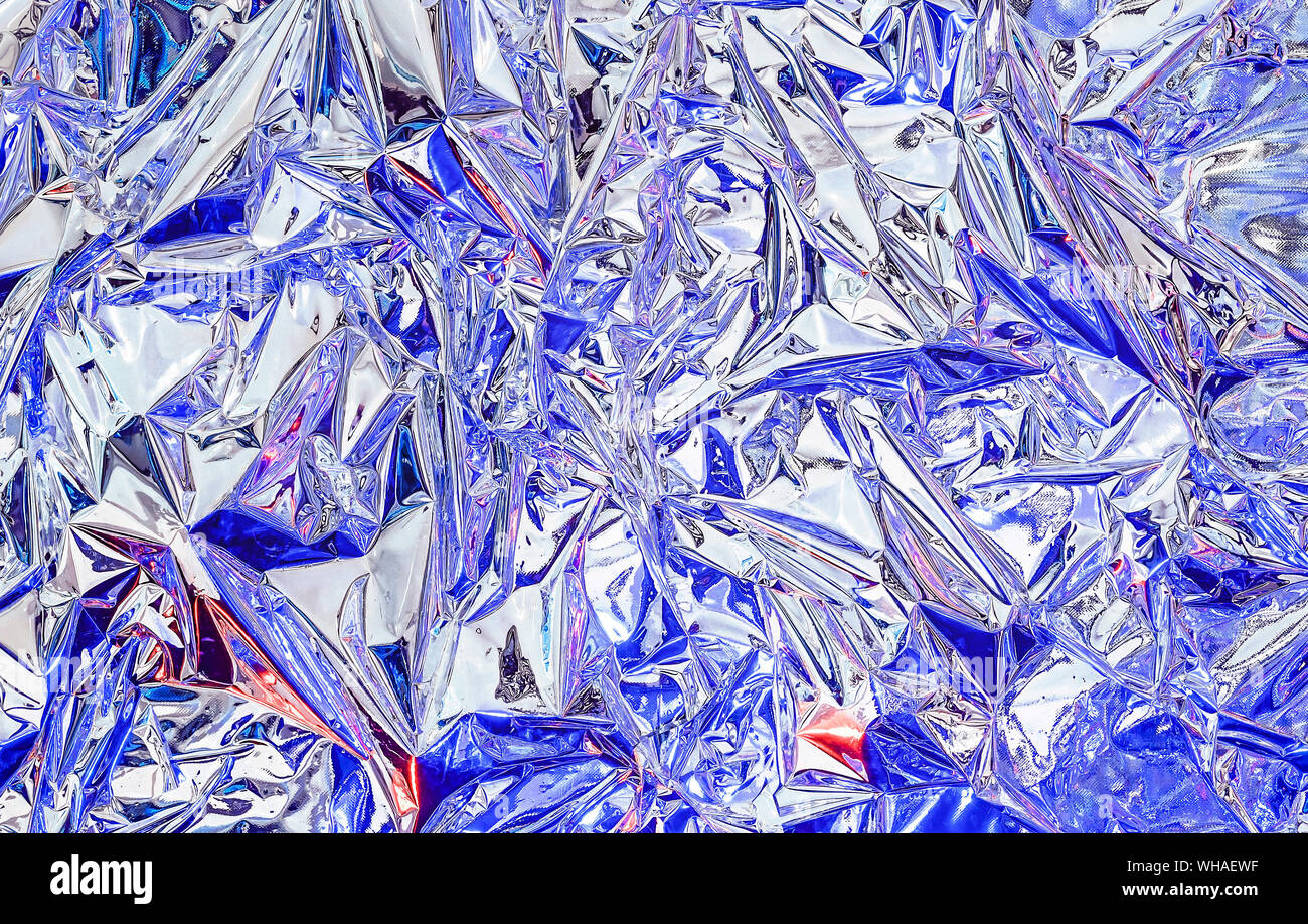 https://c8.alamy.com/comp/WHAEWF/aluminum-foil-with-multi-colored-illumination-background-and-texture-of-aluminum-foil-WHAEWF.jpg