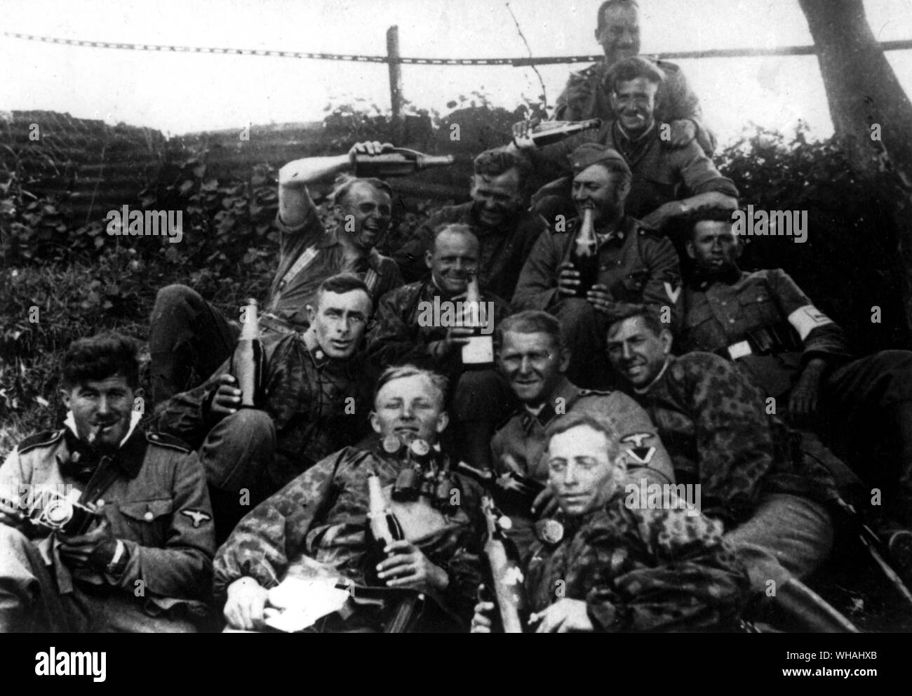On the Russian battlefront; copy of snapshot found on body of Nazi soldier showing members of invading forces during early days of attack on USSR (in SS Album, boozy Germans waving bottles!) Stock Photo