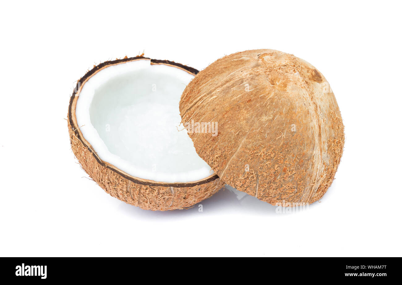 Close-up Of Halved Coconut On White Background Stock Photo