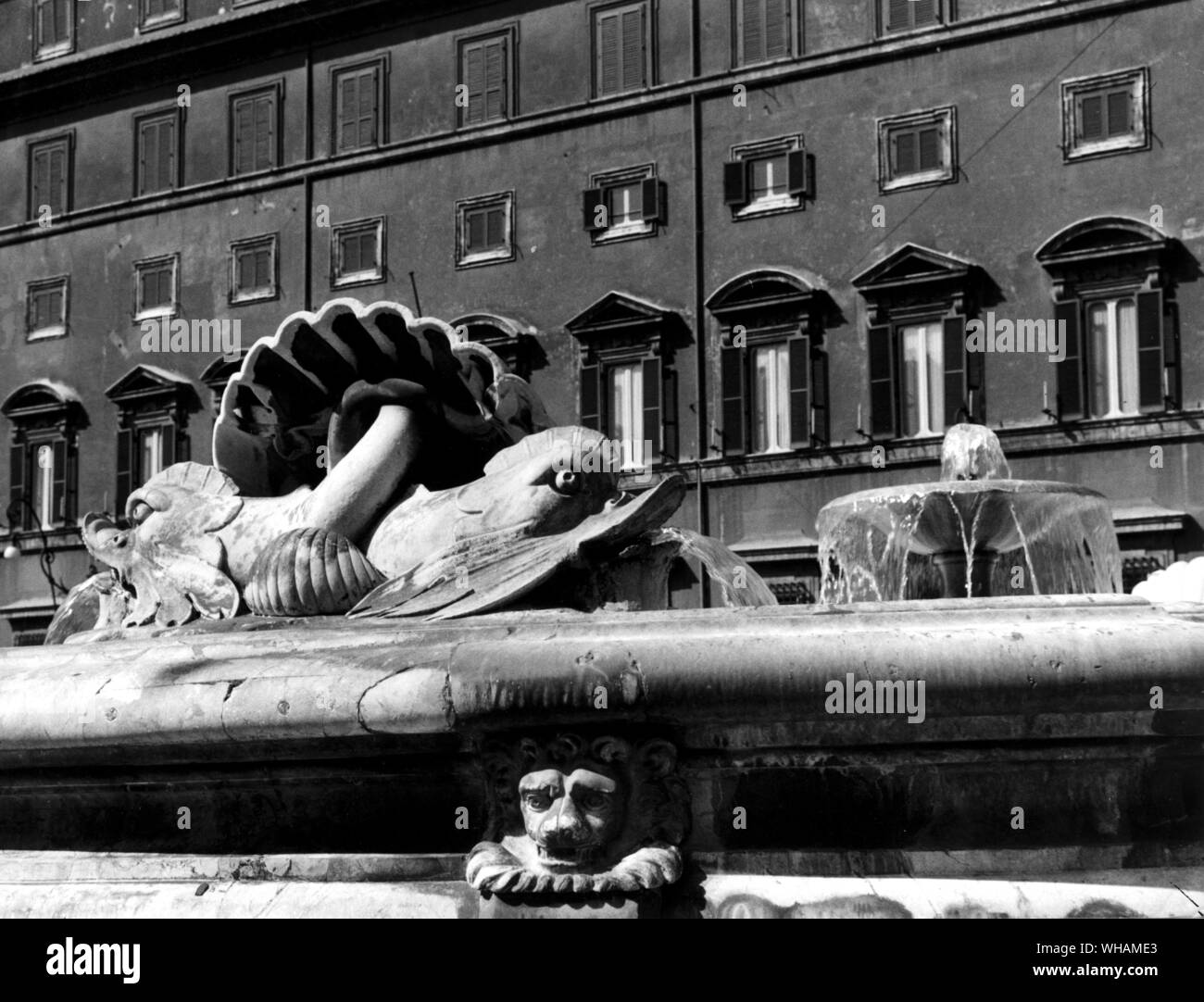 The fountain in Piazza Colonna. The lions heads date from 1575-77 the dolphins from a reconstruction of 1830 Stock Photo