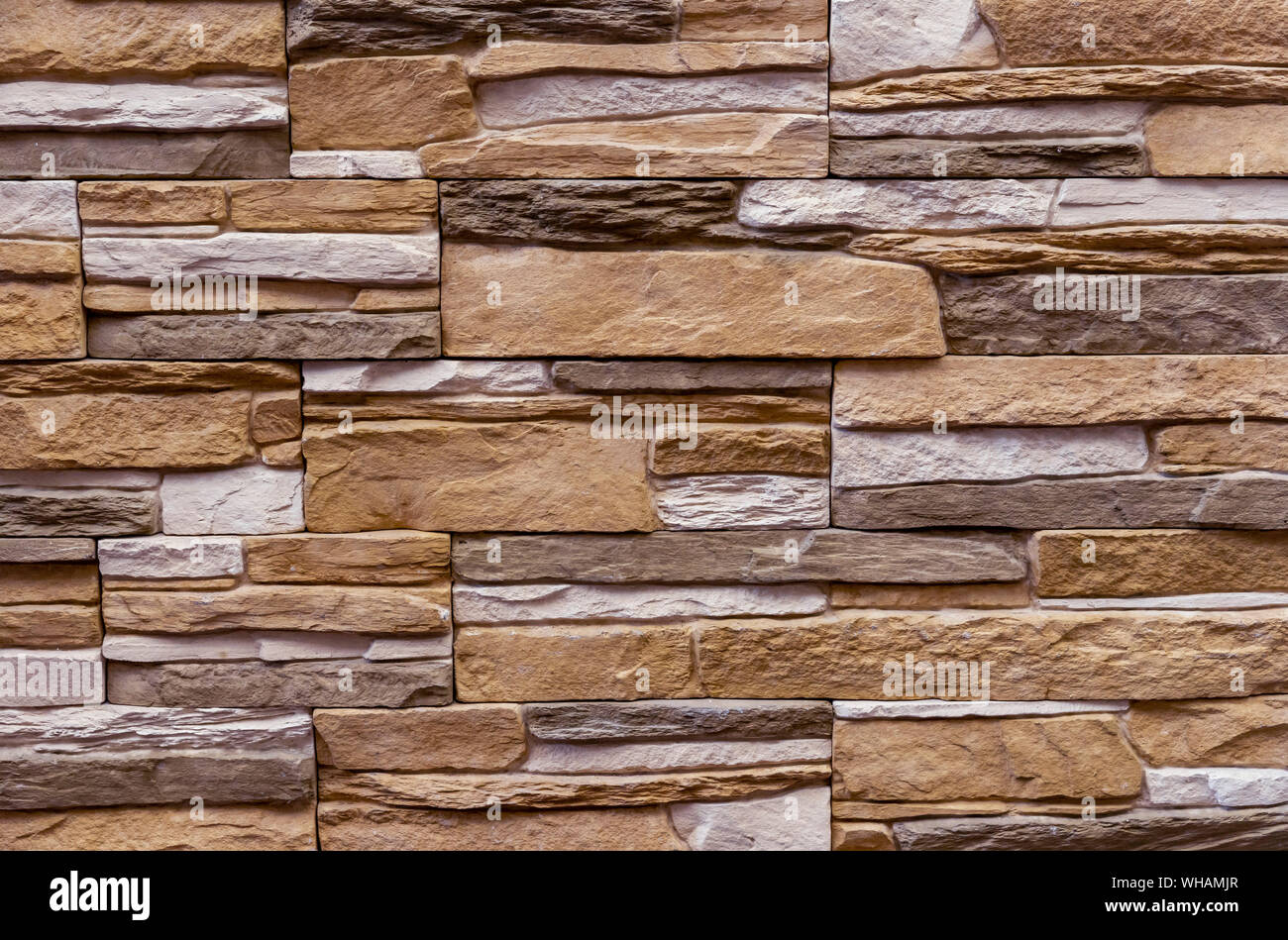 Texture of the stone wall. Panel of stones for finishing the facade of