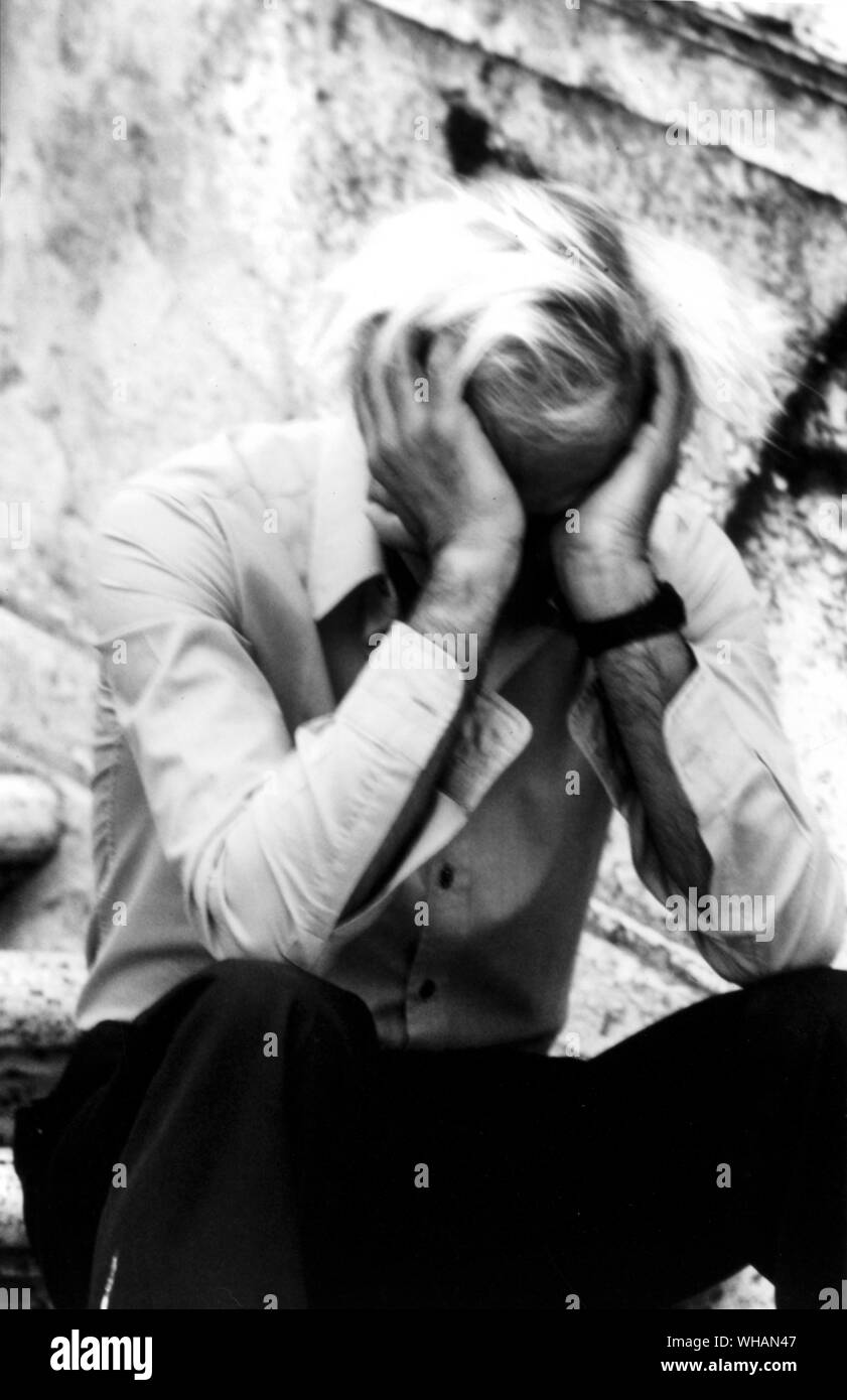Depressed man, holding his head in his hands Stock Photo