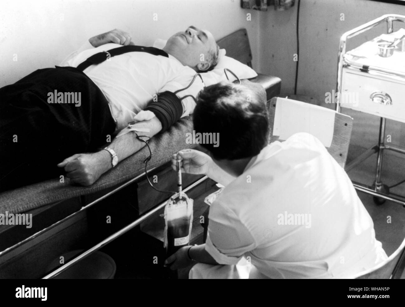 Male patient on the couch having his blood taken? Stock Photo