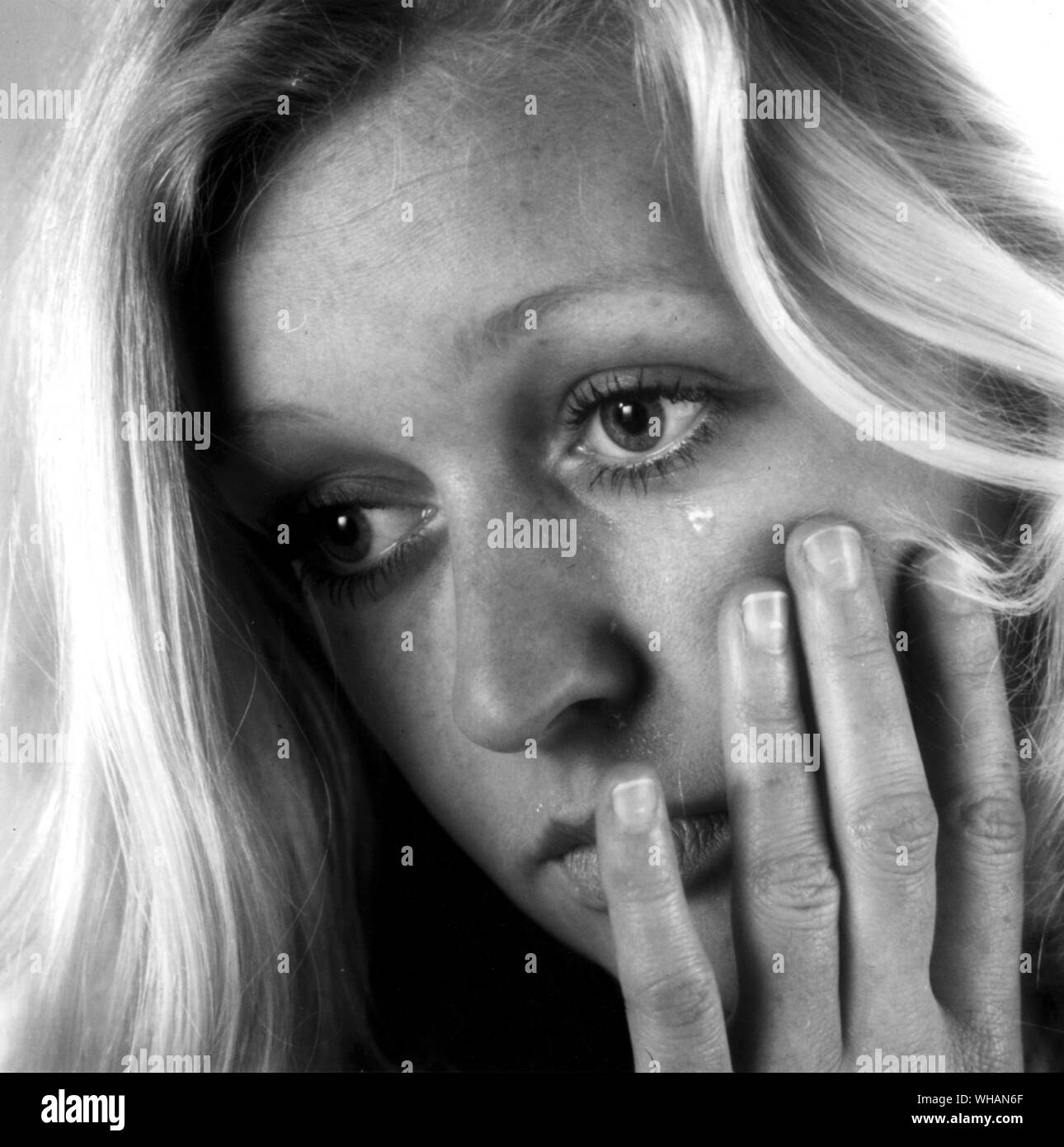 sad woman crying, looking aside on black background, closeup portrait,  profile view Stock Photo - Alamy