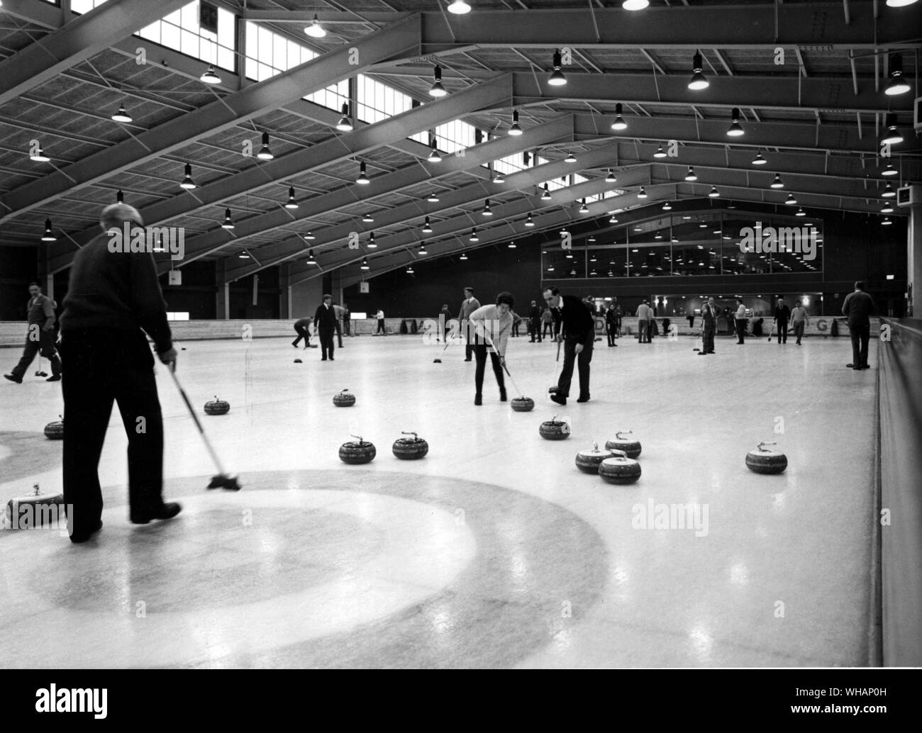 Aviemore Centre Scotland. Among the most impressive of the many facilities at the Aviemore Centre is this skating and curling rink, which has an area of 20,000 square feet. The highly polished curling stones weigh over 40 pounds. The rink has its own snack bar, and an attractive bar where one can sit and watch the sport. Stock Photo