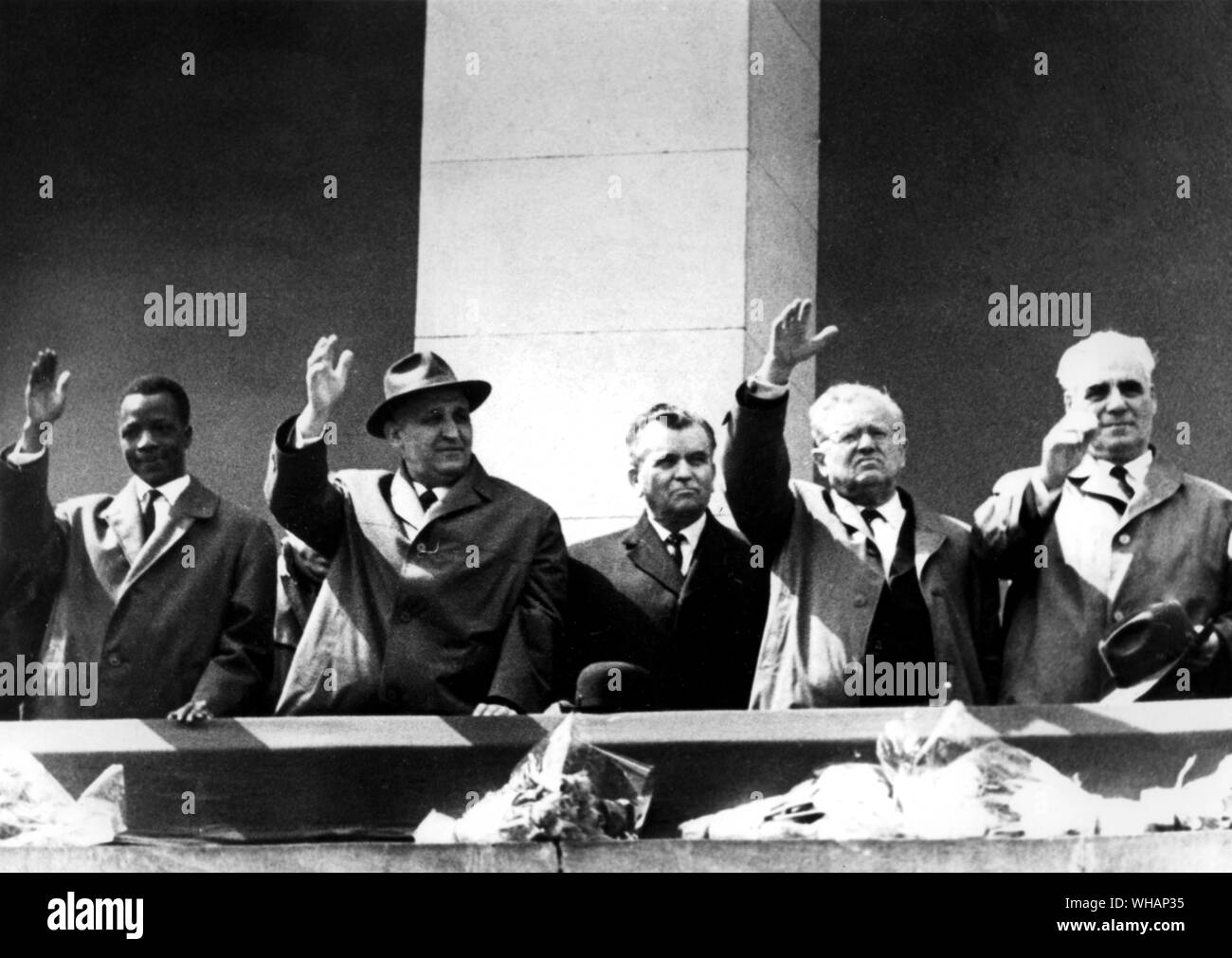 Bulgarian leaders salute from the balcony of the Georgi Dimitrov Mausoleum in Sofia during the May Day parade through 9th September Square.. From left: Unidentified guest, Prime Minister Todor Zhivkov, Party First Secretary Georgi Traikov, Polit Bureau Member Boian Balgaranov; and Entcho Staikov, Chairman of the National Council of the Fatherland Front.. . 5th May 1965 Stock Photo