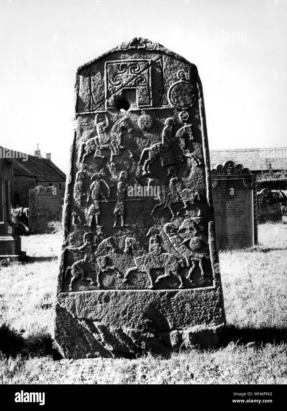 Aberlemno. Pictish Symbol Stone in churchyard (backside with horsemen etc). Stock Photo