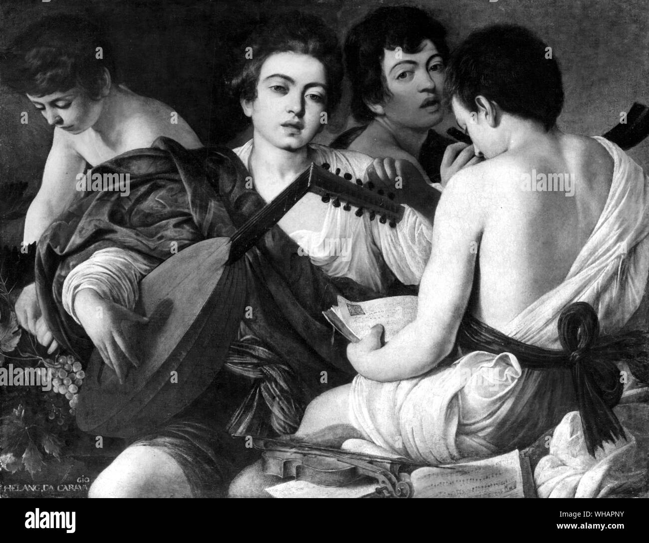 The Musicians. by Michelangelo Merisi da Caravaggio. Italian Roman 1573-1610. Probably the most revolutionary artist of his time, the Italian painter Caravaggio abandoned the rules that had guided a century of artists before him. They had idealized the human and religious experience.. The two figures seen frontally are undoubtably portraits, and this fact disorients those who would like to make a conventional reading of the scene and concentrate on the noble, classical character of the composition, organized around the traditional opposition between the figure of the lute player and the Stock Photo
