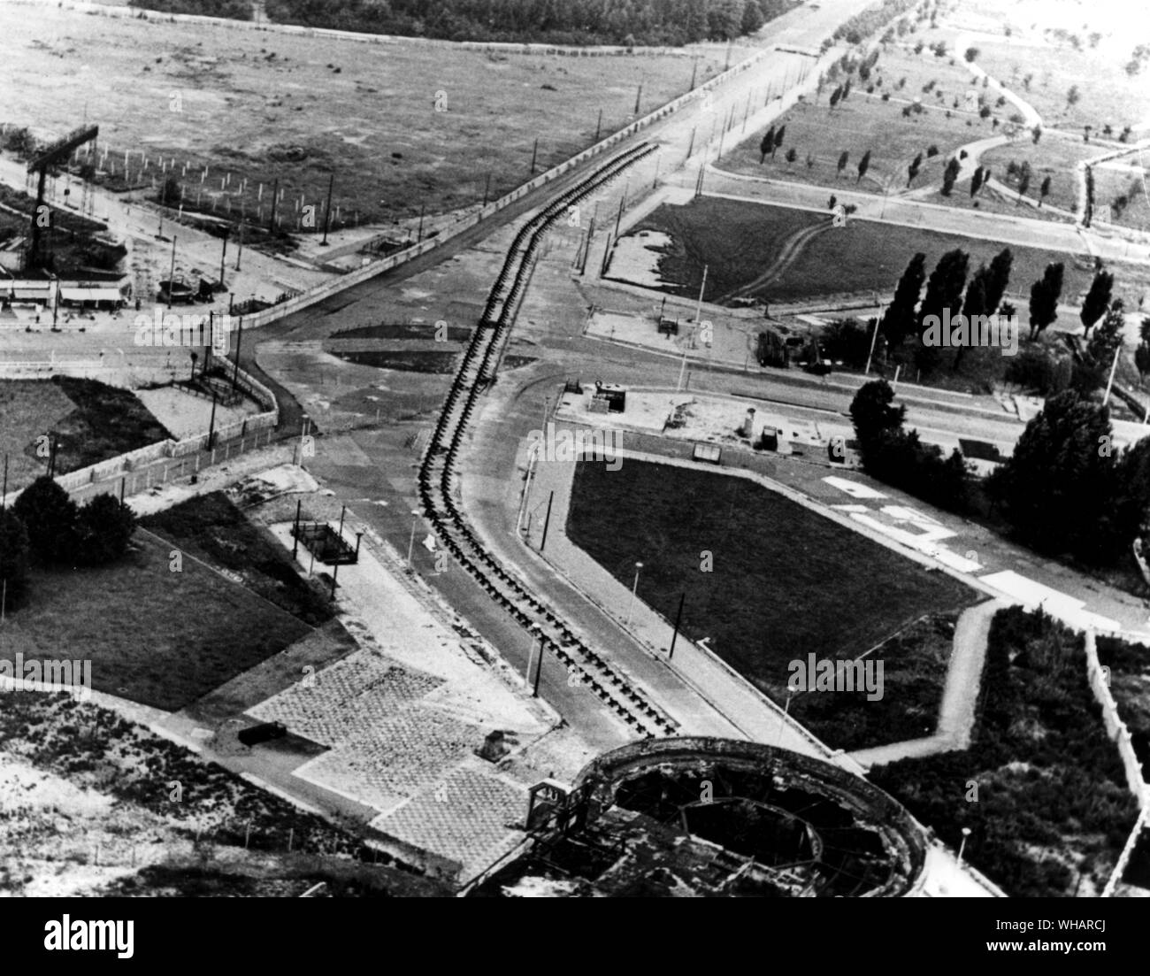 The wall built by the East German Communists in their closure of the border between East and West Berlin. The wall and tram line tank obstacles at Potsdamer Platz, at upper left can be seen part of Hitler's Chancellery Garden. 10th August 1962 Stock Photo
