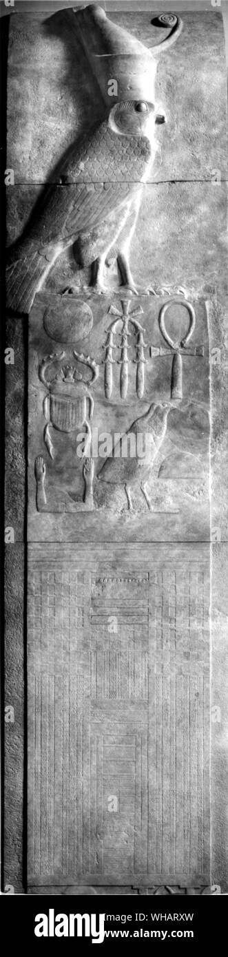 Egyptian Antiquities, sulpture, relief, 12th dynasty. Panel figure of the falcon God Horus wearing the double crown of Upper and Lower Egypt; and the two names of King Se'n Wosret I (his Horus name Ankh mesut) and his throne name Kheper Ke Re. Stock Photo