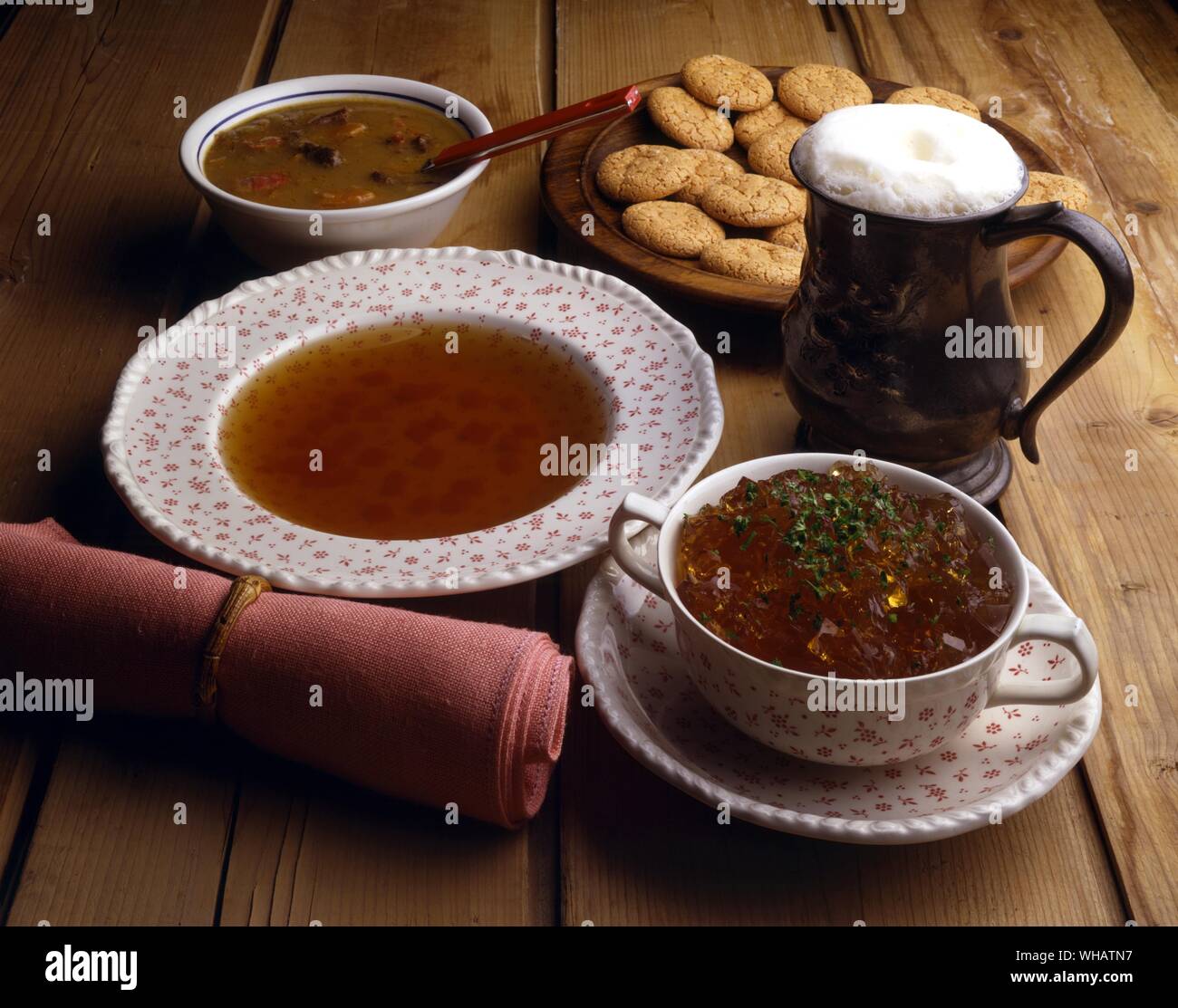 International Cooking . Top, Oxtail Soup.. Ochsenschwanzsuppe, Germany.. Bottom, Consomme Madrilene.. France. Stock Photo