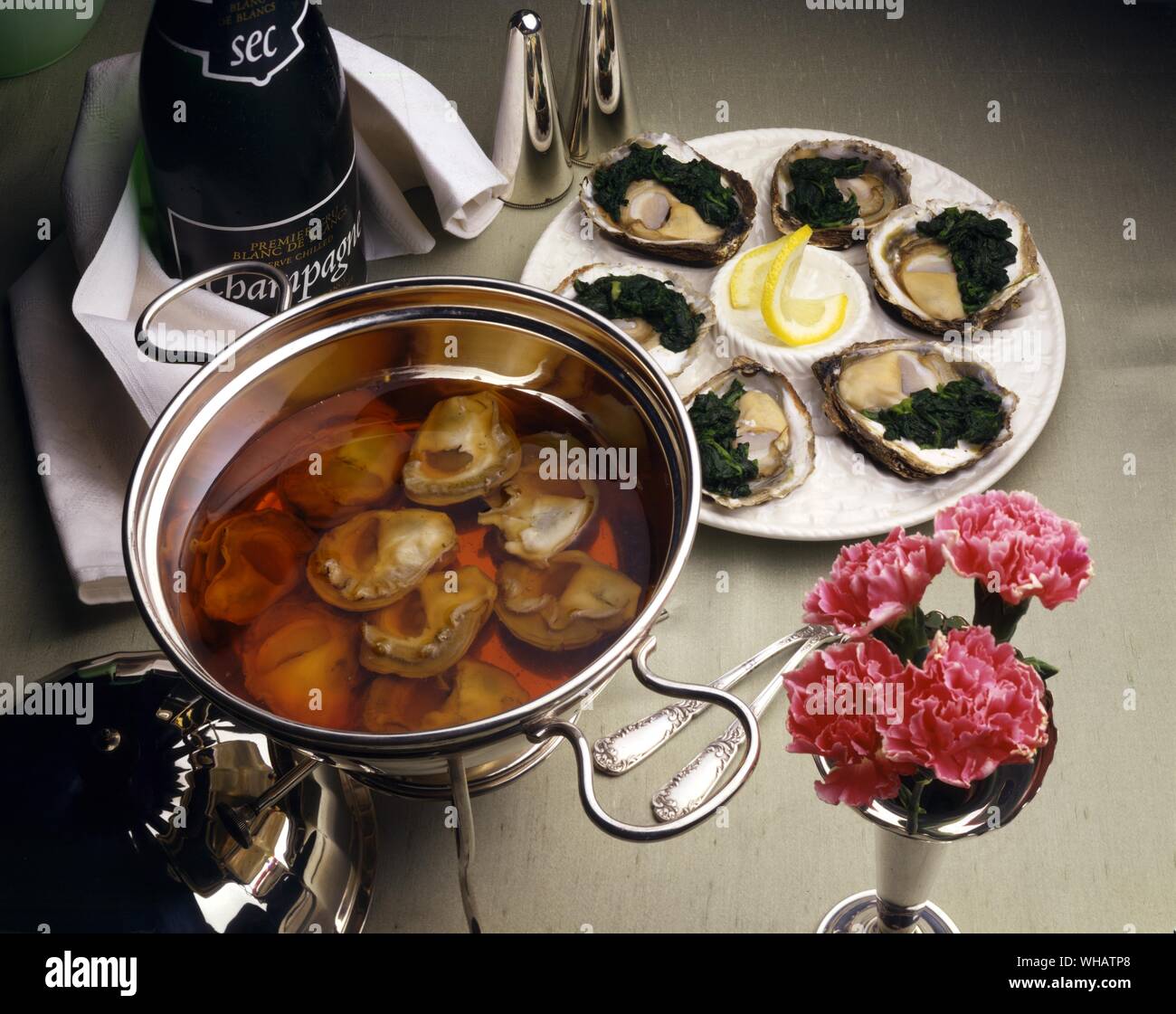 International Cooking . Left, Oysters In Champagne.. USA.. . Right, Oyster Rockefeller.. USA.. Stock Photo