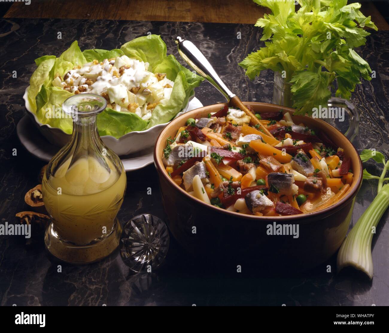 International Cooking . Left, Waldorf Salad.. USA.. . Right, Russian Salad.. Vinyegryet, Russia. Stock Photo