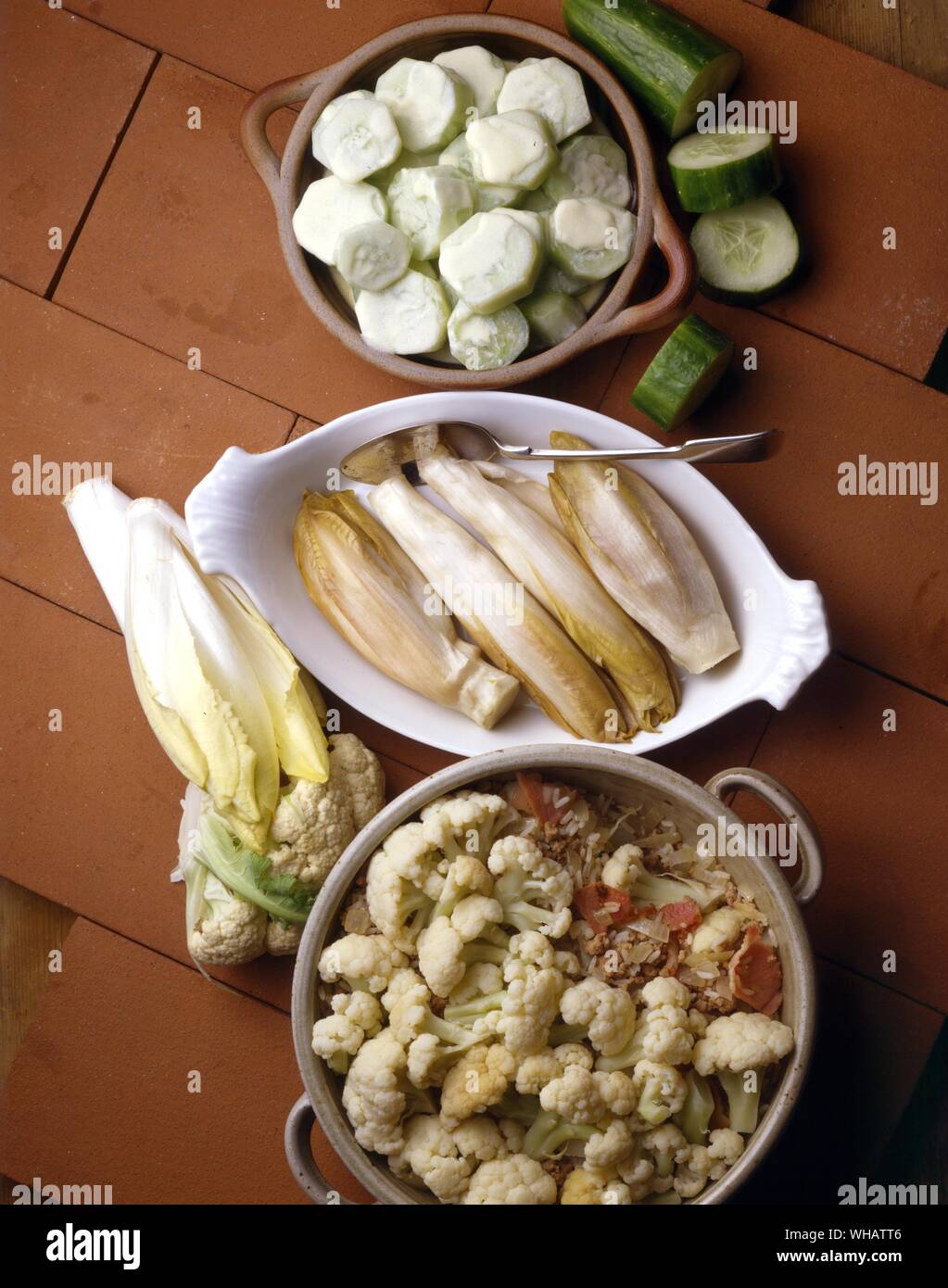 International Cooking . Left To Right. Cauliflower Musaka.. Musaka Od Karciola, Yugoslavia.. . Chicory.. Chicoree, Belgium.. . Cucumbers In Cream.. Concombres A La Creme, France. Stock Photo