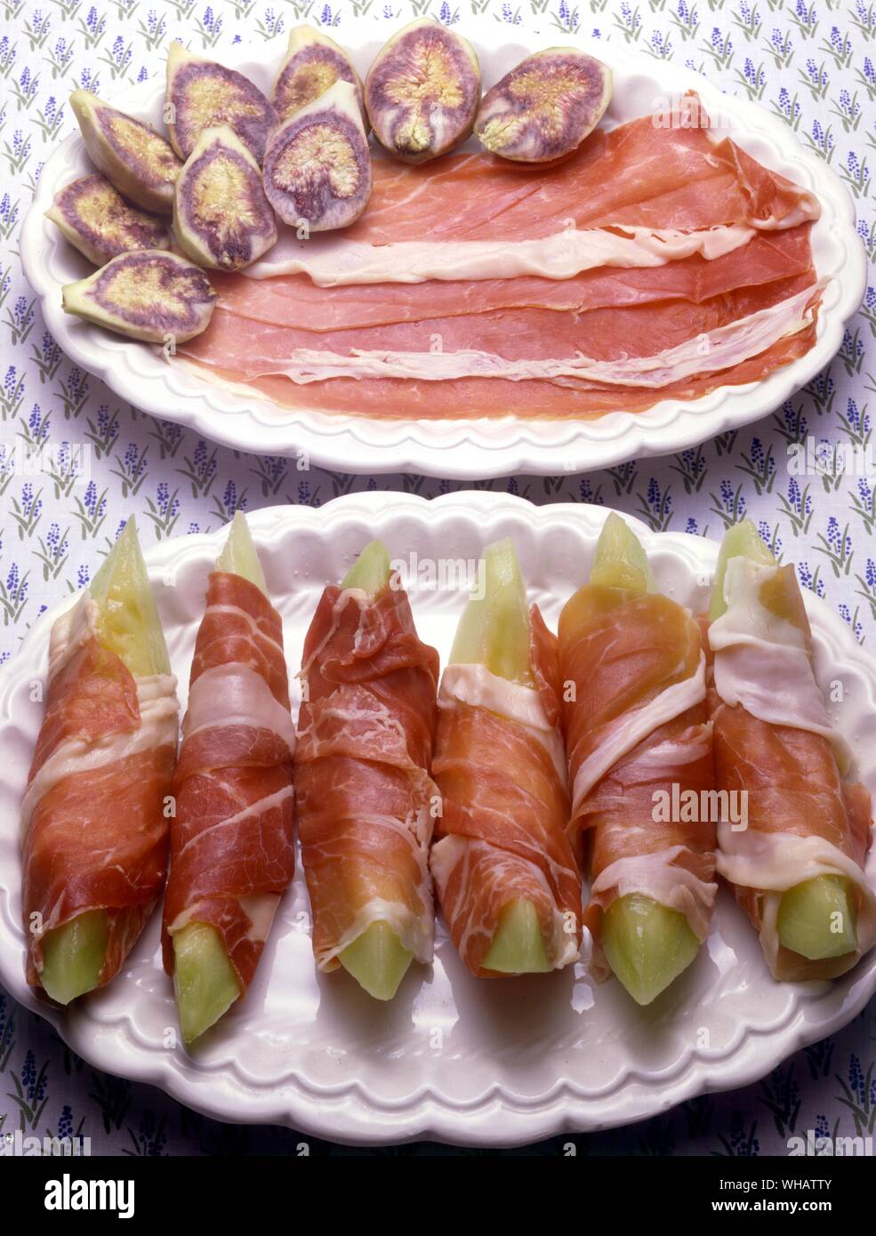 Italian Cooking . Prosciutto Con Fichi.. Smoked Ham With Figs.. . Prosciutto Con Melone.. Smoked Ham With Melon. Stock Photo