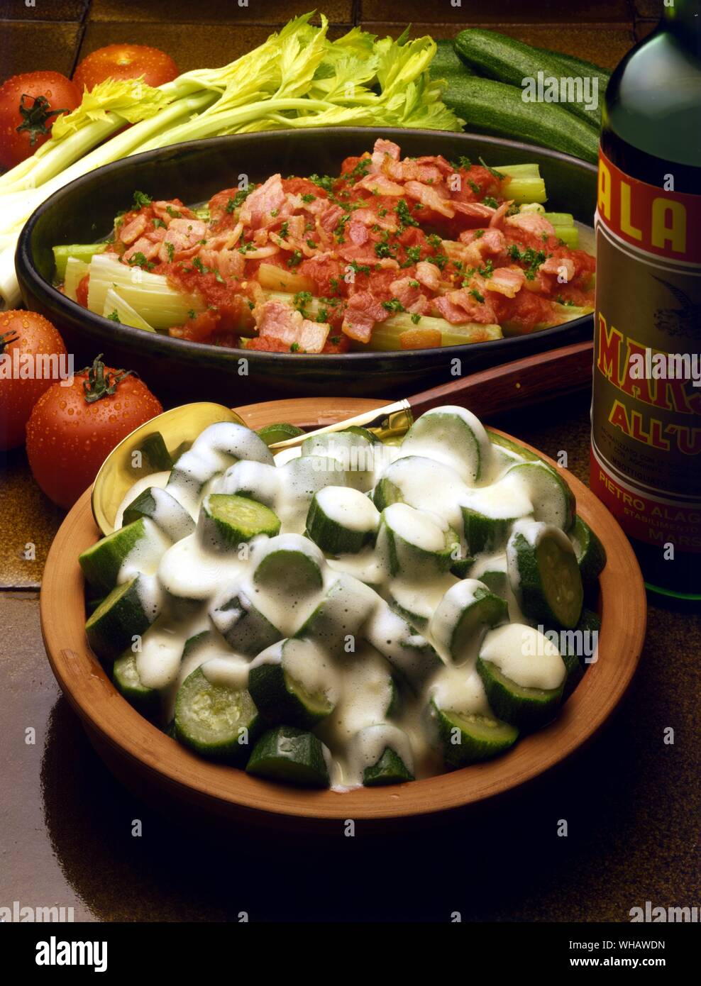 Italian Cooking . . Top.. Sedano Al Forno.. Baked Celery With Bacon And  Tomatoes.. . Bottom.. Zucchini In Salsa Al Marsala.. Courgettes In A  Marsala Sauce Stock Photo - Alamy
