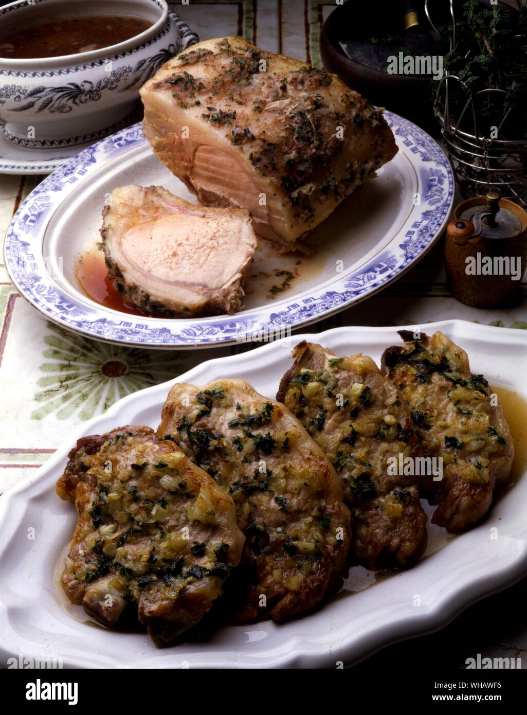 French Recipes By Jill Pound-Corner.. . Top.. Carre De Porc Provencal.. Roast Loin Of Pork With Herbs.. . Bottom.. Cotes De Porc Valle D'Auge.. Pork Chops In Cider Sauce.. Stock Photo