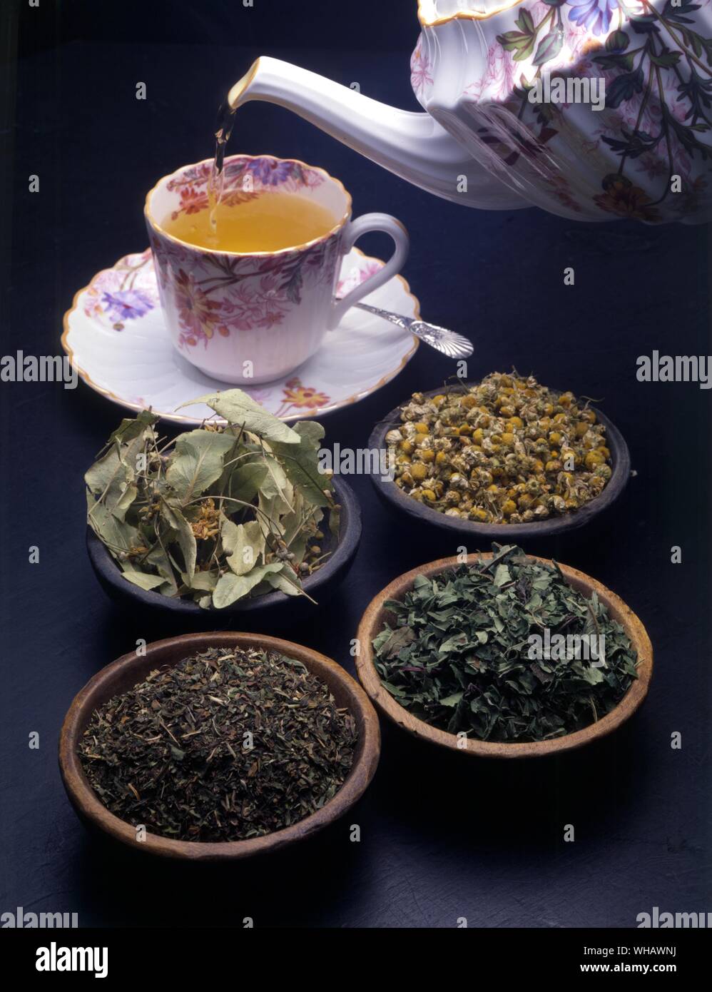 Lime flower tea being poured. Lime Flower Camomile. Peppermint Bergamot Stock Photo