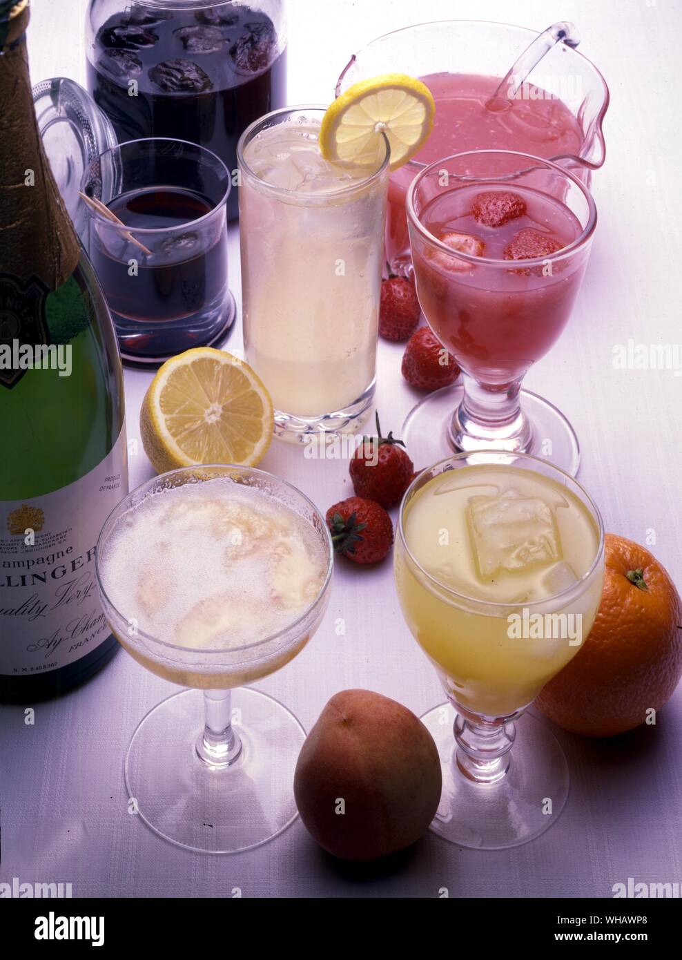 Pruneaux au vin rouge. Prunes in Red Wine. . Punch au vin blanc. White Wine Punch. . Boisson d'apres-diner. Summer after Dinner Drink. . Boisson d'ete. Non alcoholic Raspberry Drink. . Orange et citronnade. Non alcohollic orange and lemon drink Stock Photo