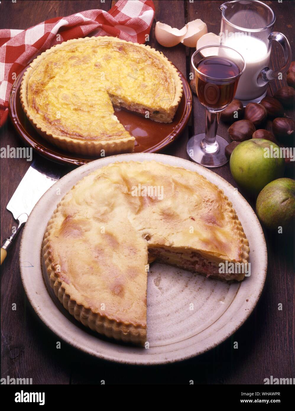 French Cooking By Eileen Reece.. . Top.. Tart A L'Oignon Alsacienne.. Onion Tart.. . Bottom.. Tourte Ardennaise.. Pork, Apple And Chestnut Pie. Stock Photo
