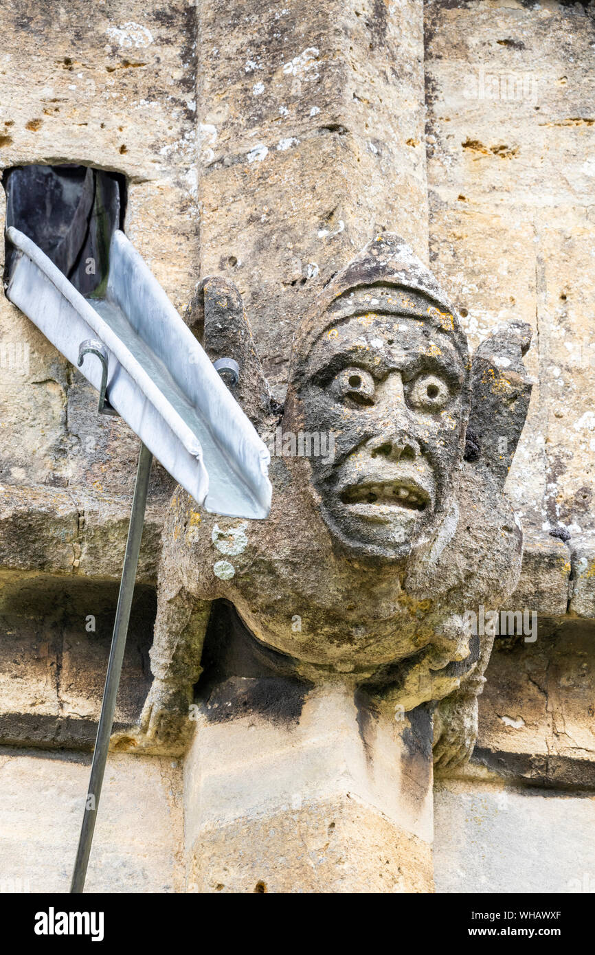 Medieval gargoyle on St Peters church (1465) in the Cotswold town of