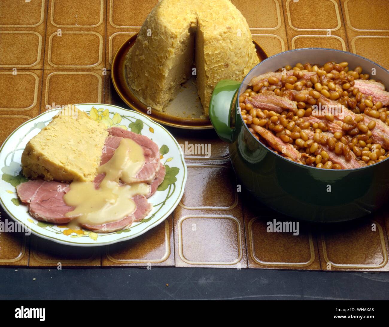 Beans and Bacon. Ham Knuckle with Pease Pudding Stock Photo