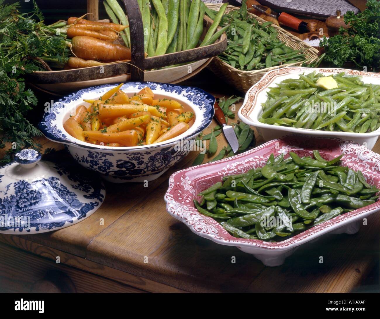 Glazed Young Carrots. Mange Tout or Sugar Peas . Bright Green Beans Stock Photo