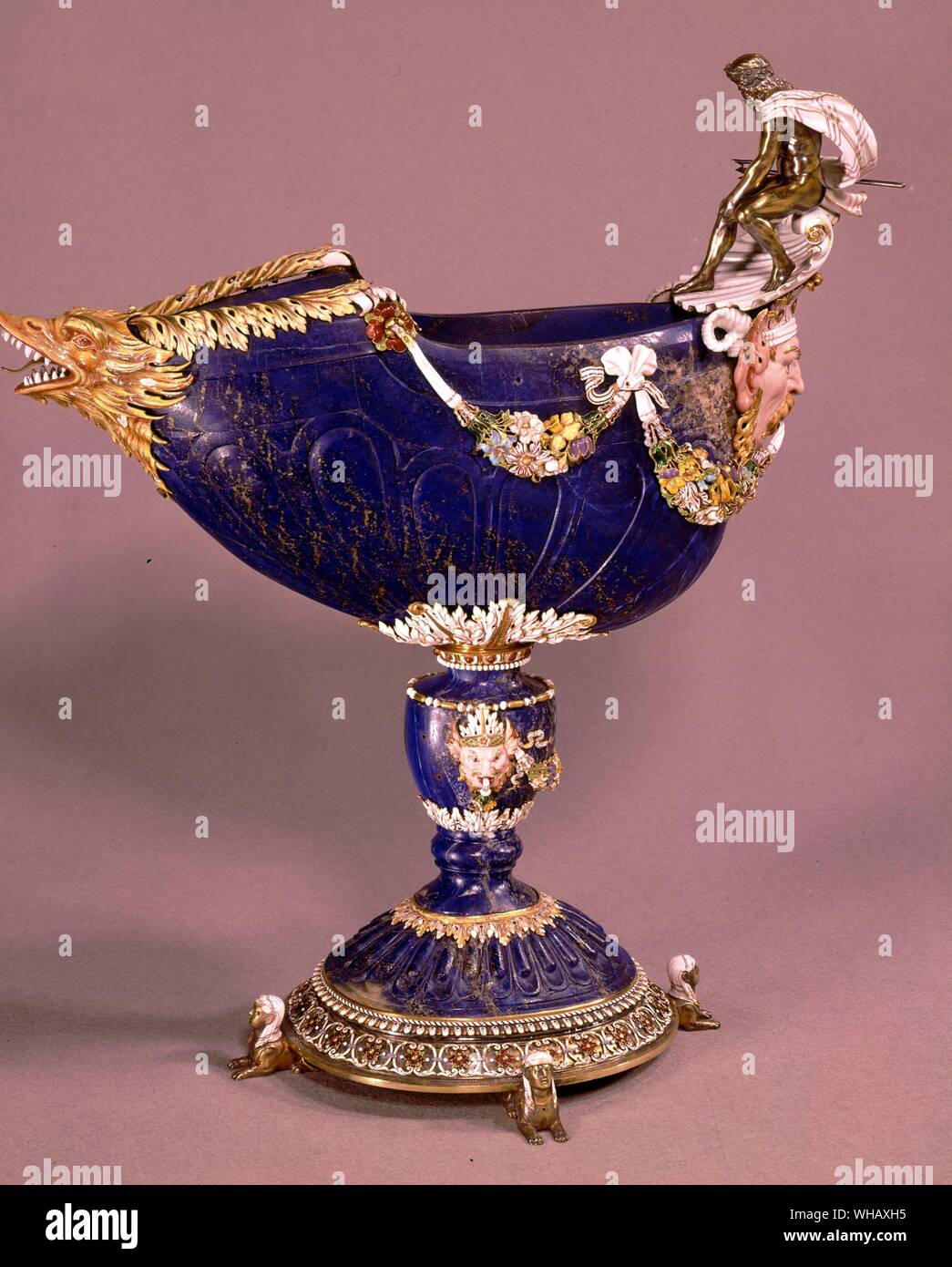 Cup in lapis lazuli surmounted by Neptune in silver garlands of ceramic and enamelled flowers. Sphinxs at base and exotic animals, from Louis XIV collection of jewels. The Sun King by Nancy Mitford, page 153. Stock Photo
